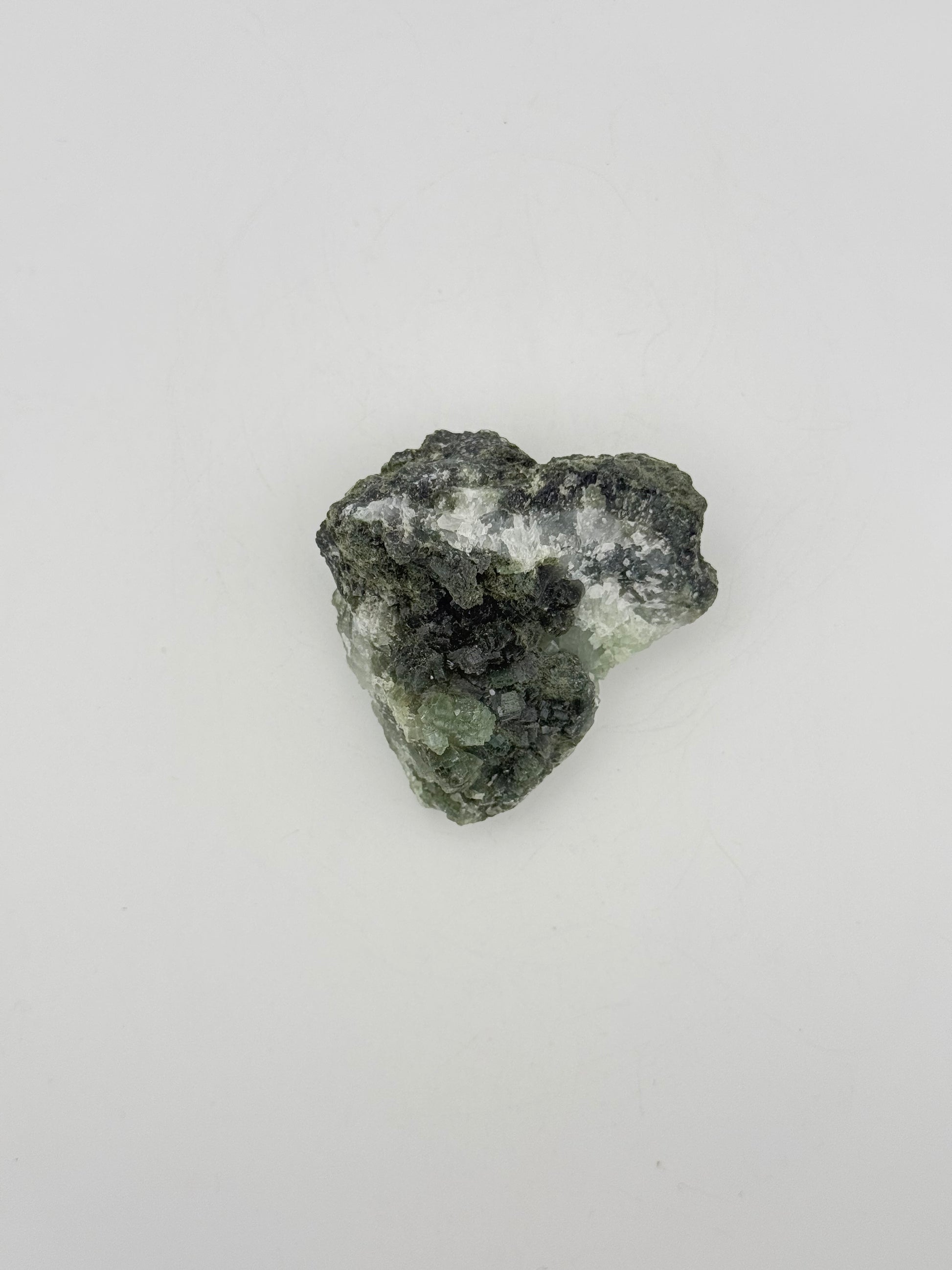 Raw Prehnite specimen with amazing green color.