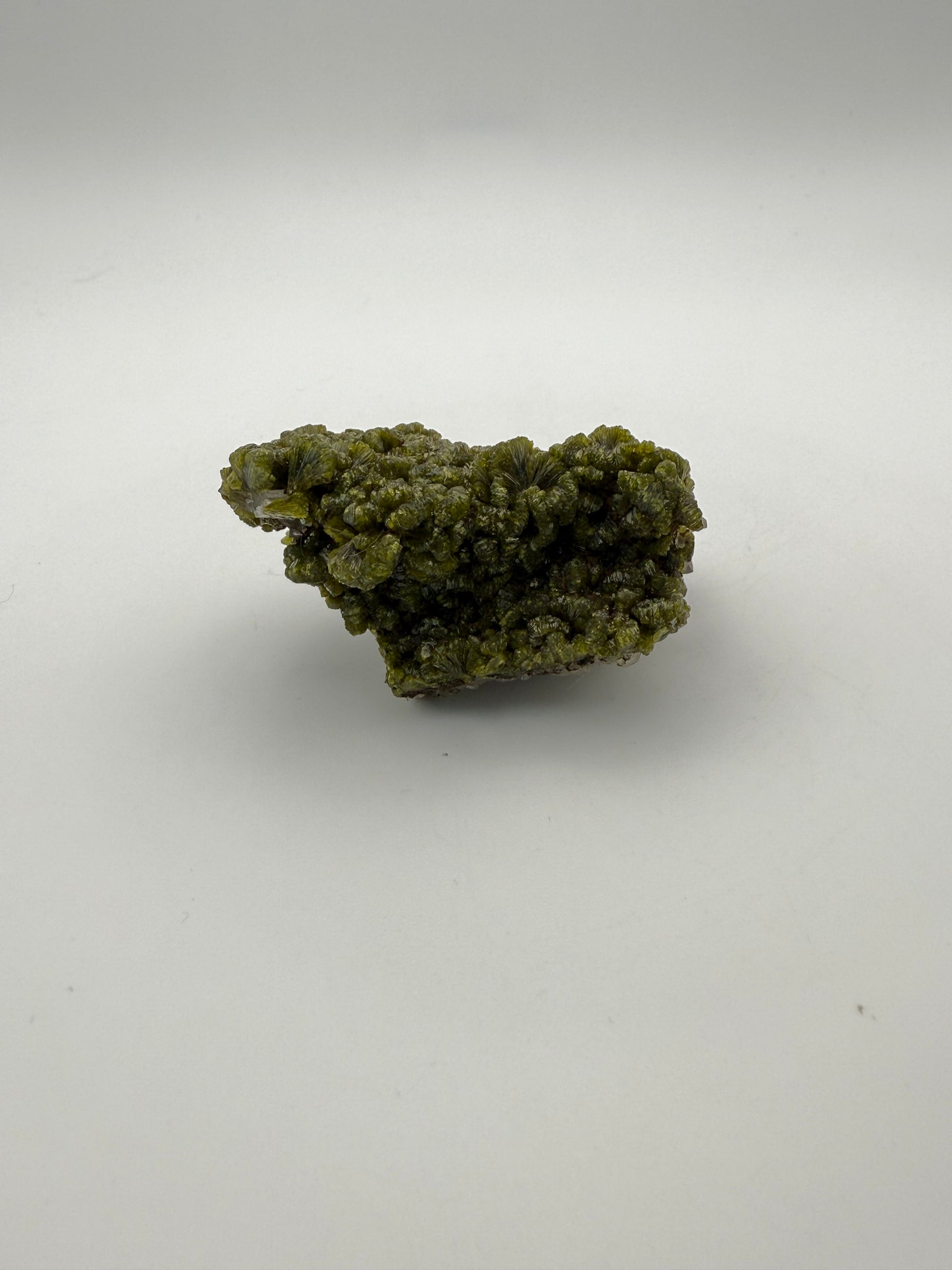 Epidote crystal cluster with good green color.
