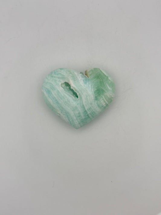 Caribbean Calcite polished crystal in the shape of a heart.