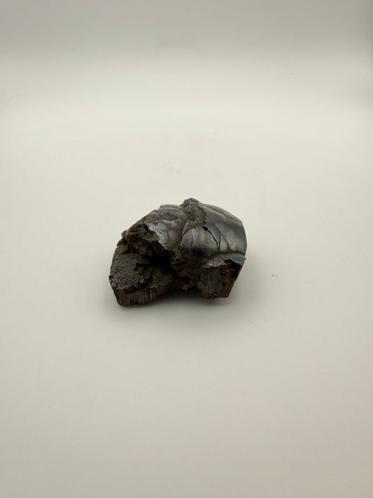Small raw hematite specimen.
