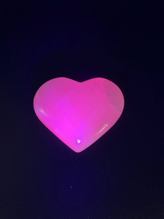 Polished Pink Calcite heart. Pink calcite is uv reactive.
