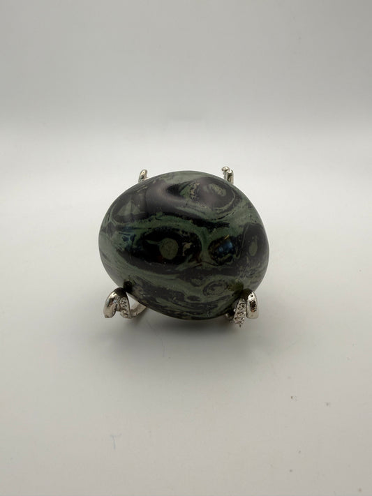 Polished kambaba jasper palm stone.