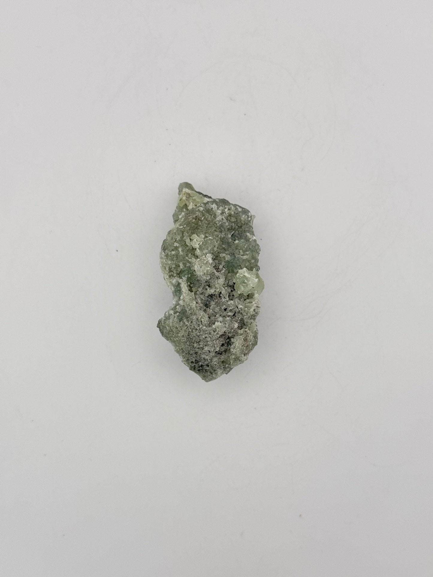 Raw Prehnite specimen with amazing green color.