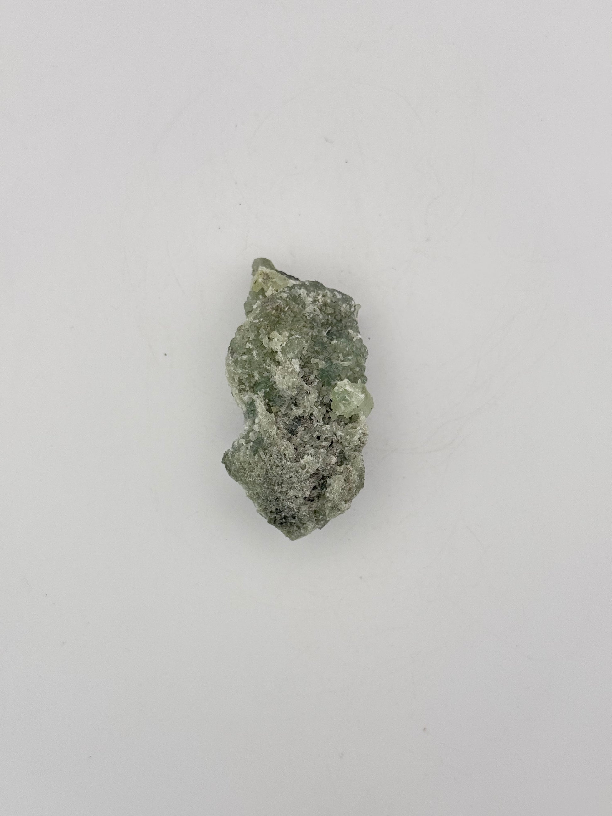 Raw Prehnite specimen with amazing green color.