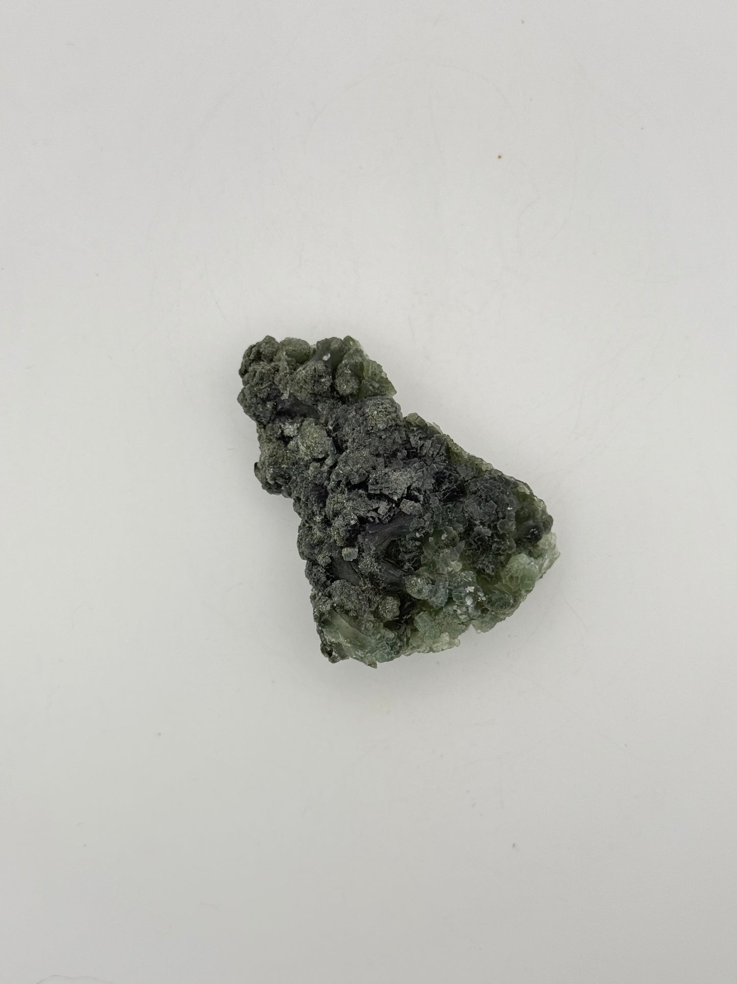 Raw Prehnite specimen with amazing green color.