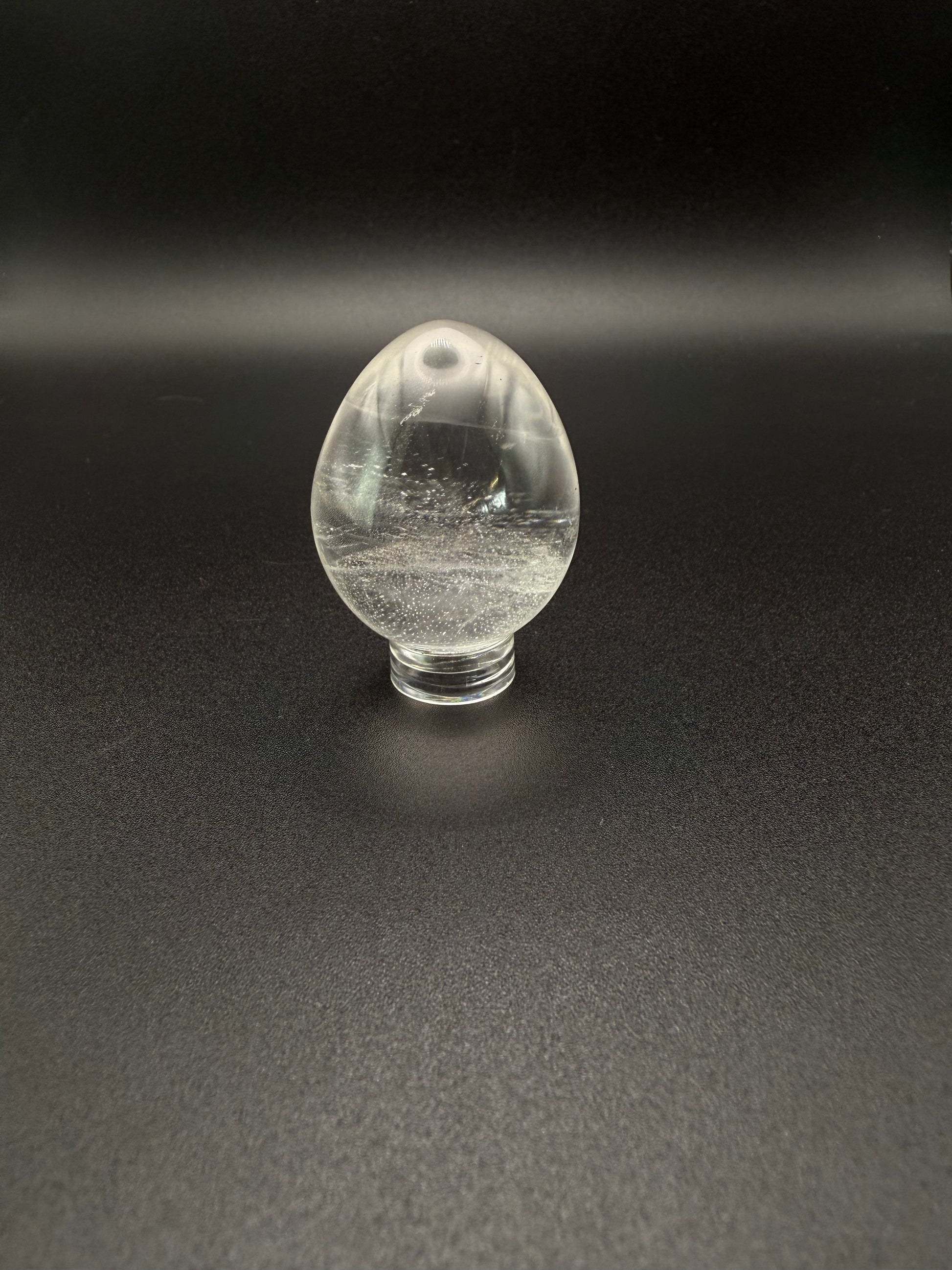 Clear quartz polished crystal in the shape of an egg.