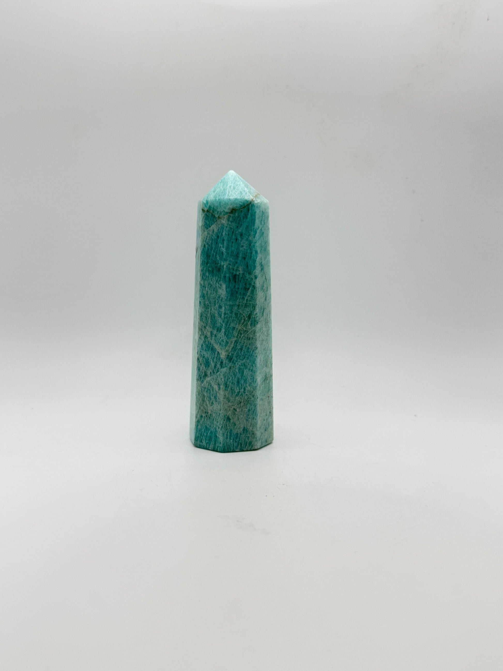 Amazonite tower with eight sides, that is about 4inches tall with a width of 1 1/4inches.
