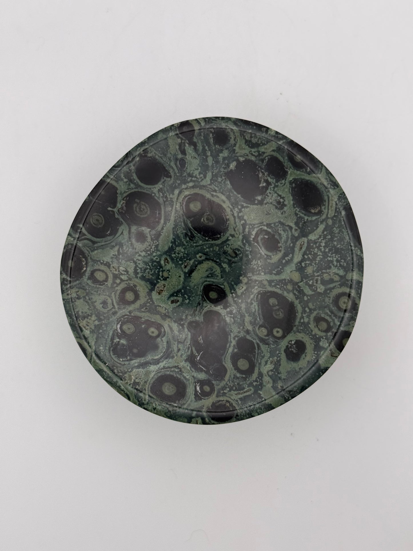 Polished kambaba jasper in the shape of a bowl.
