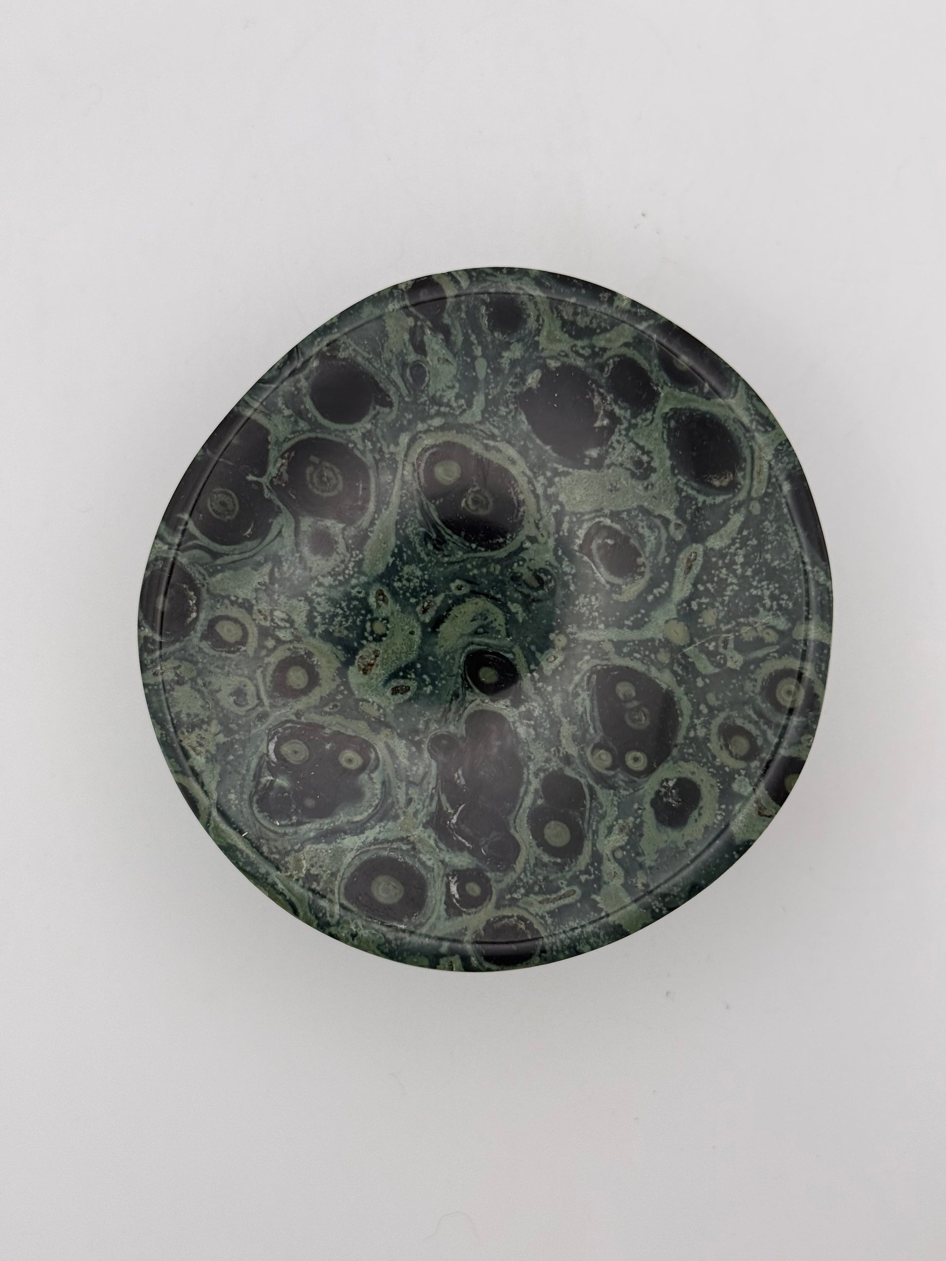 Polished kambaba jasper in the shape of a bowl.