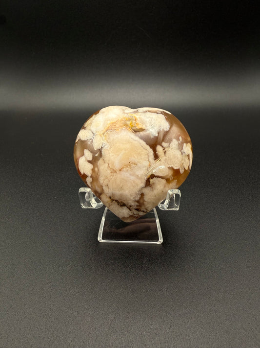 Flower Agate polished crystal in the shape of a heart.