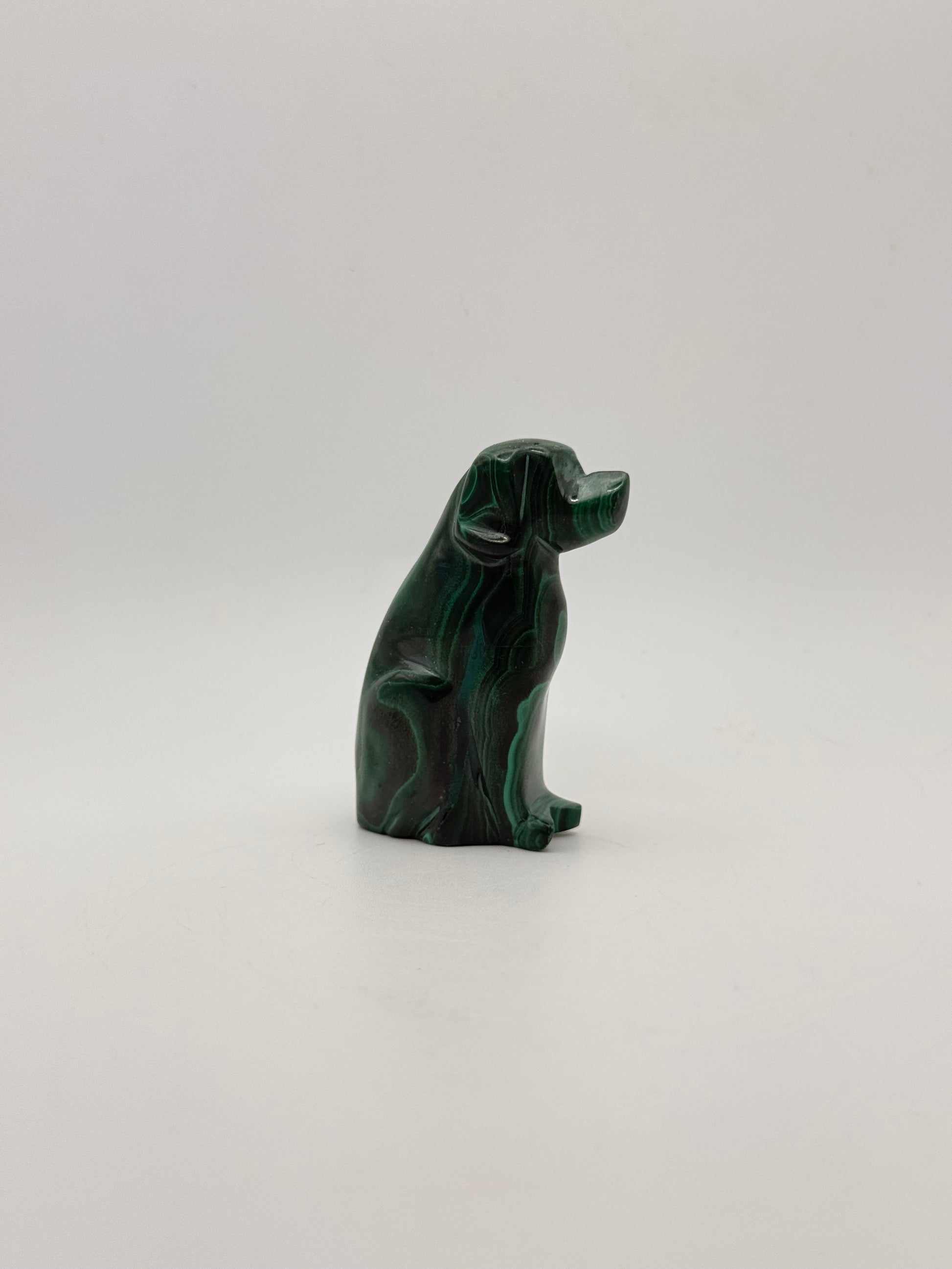 Polished malachite dog carving.