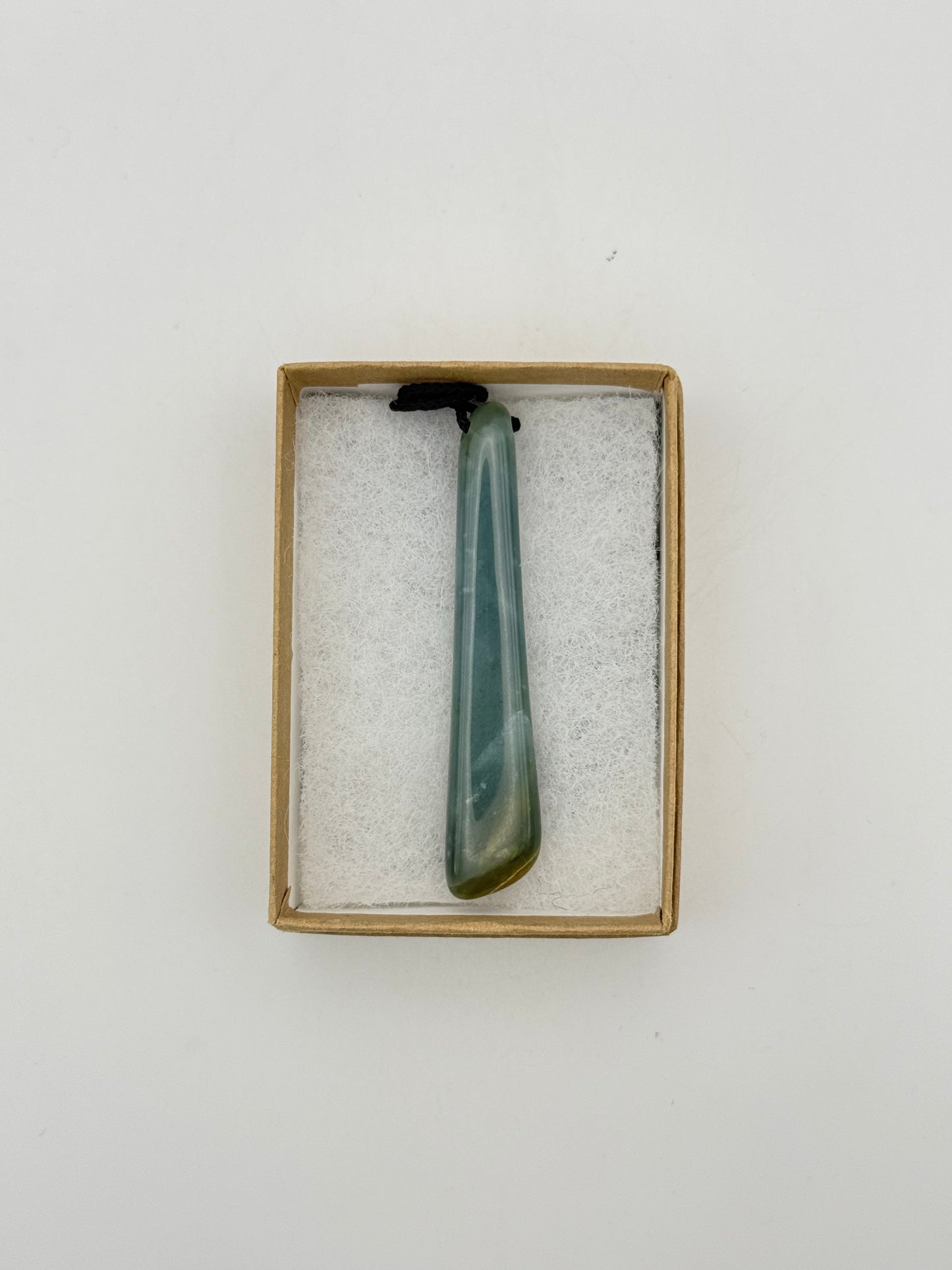 Green Jade pendant with string necklace.