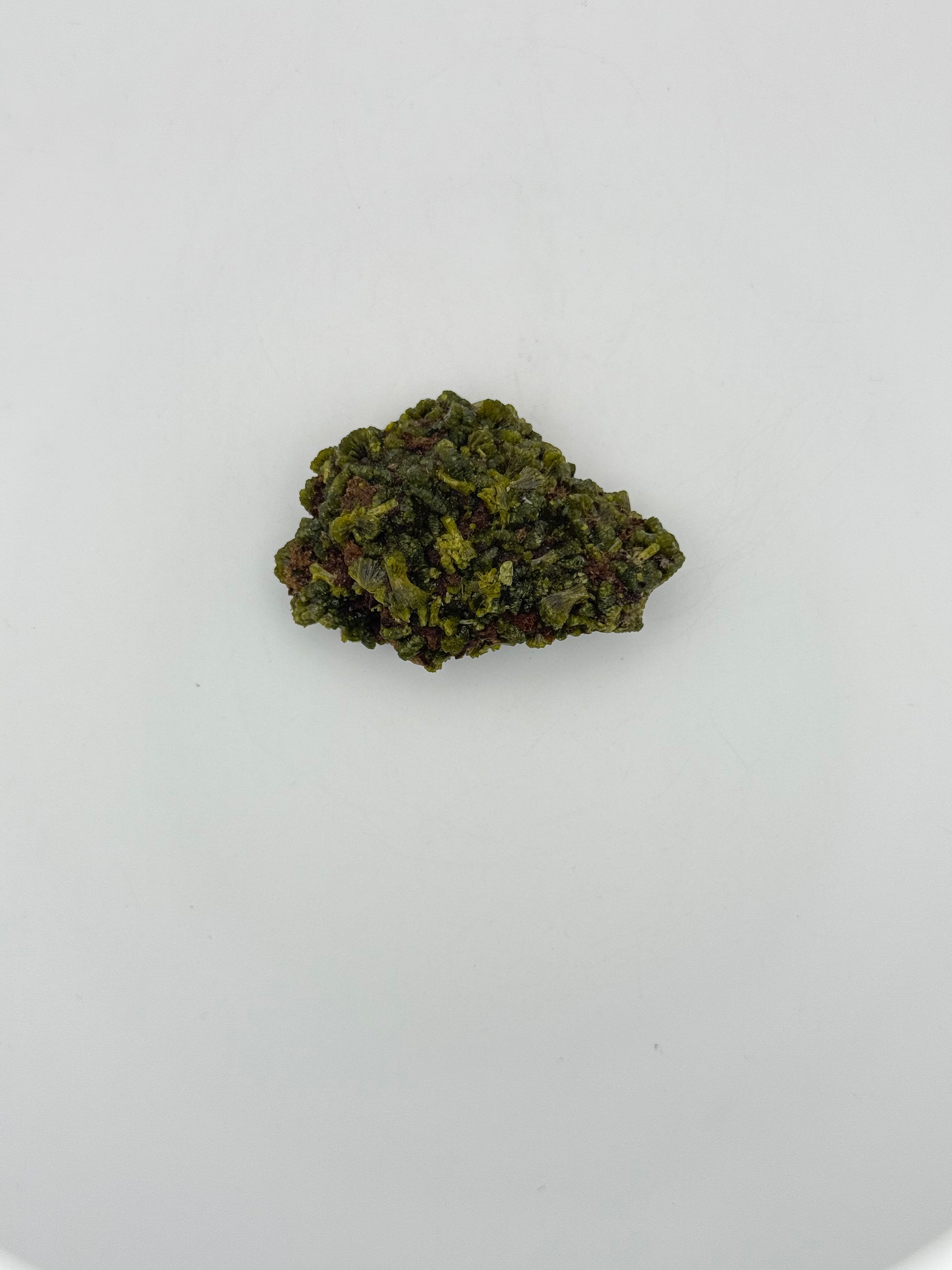 Epidote crystal cluster with good green color.