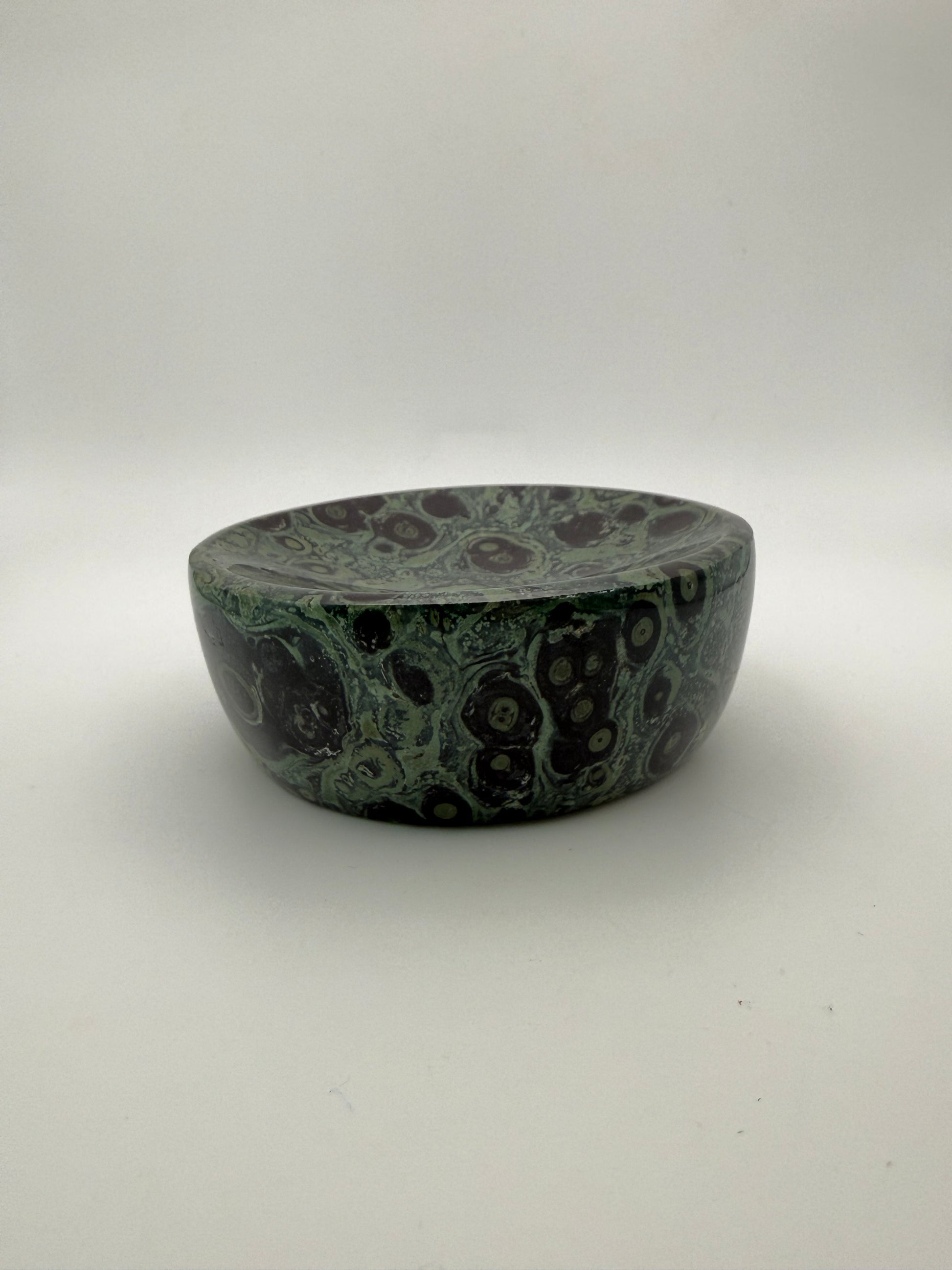 Polished kambaba jasper in the shape of a bowl.