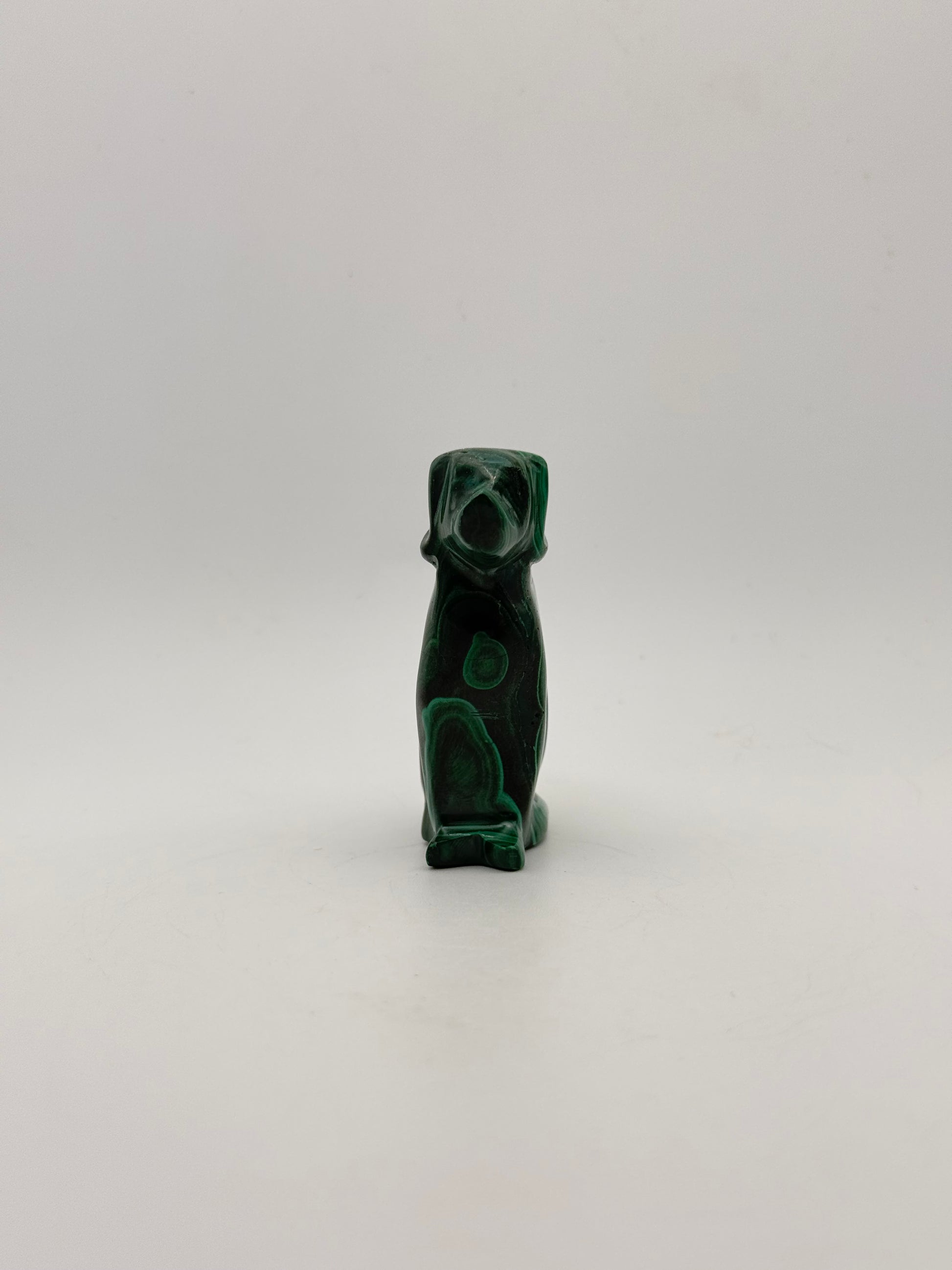 Polished malachite dog carving.