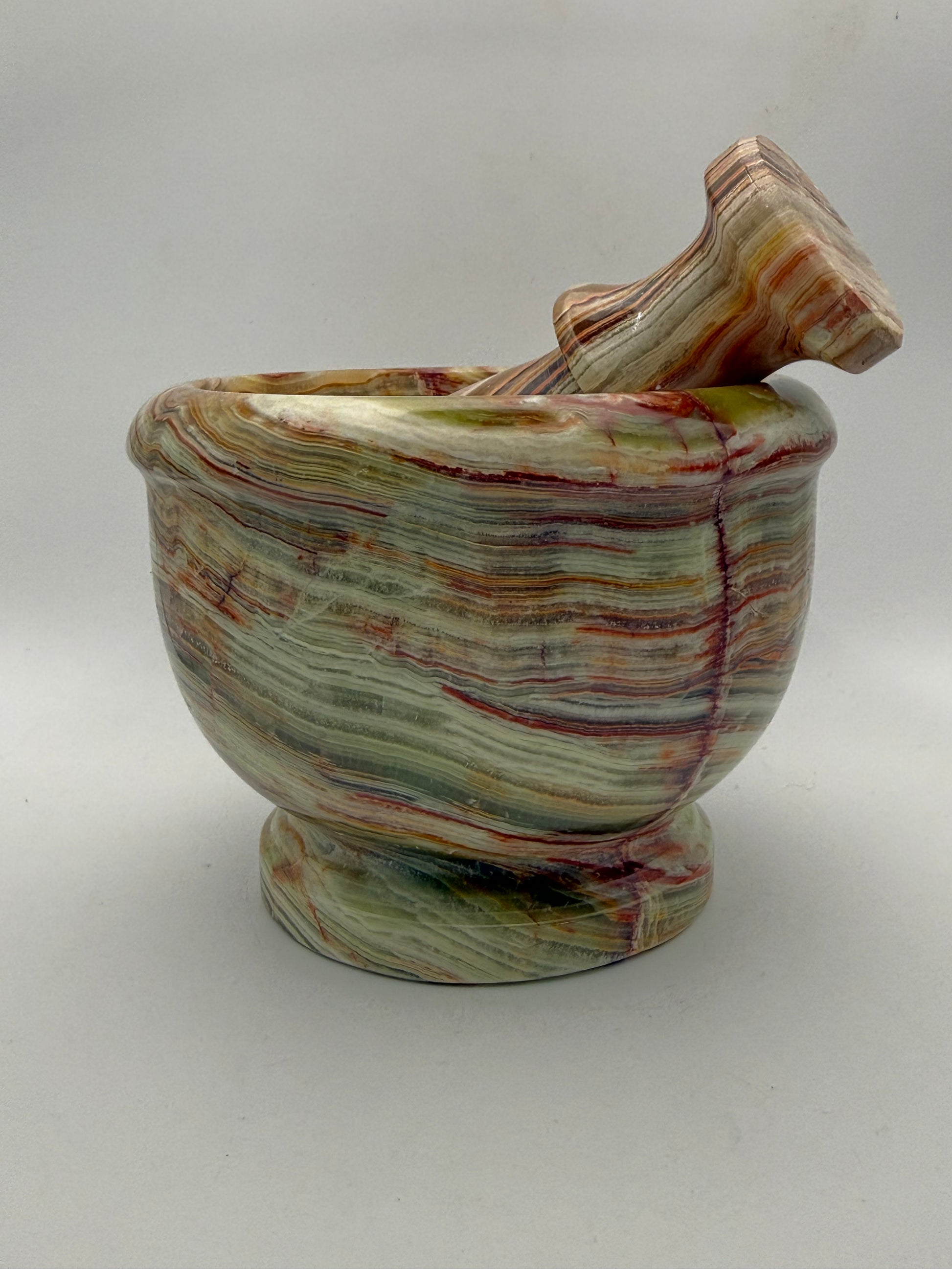 Mortar and pestle made out of onyx stone.