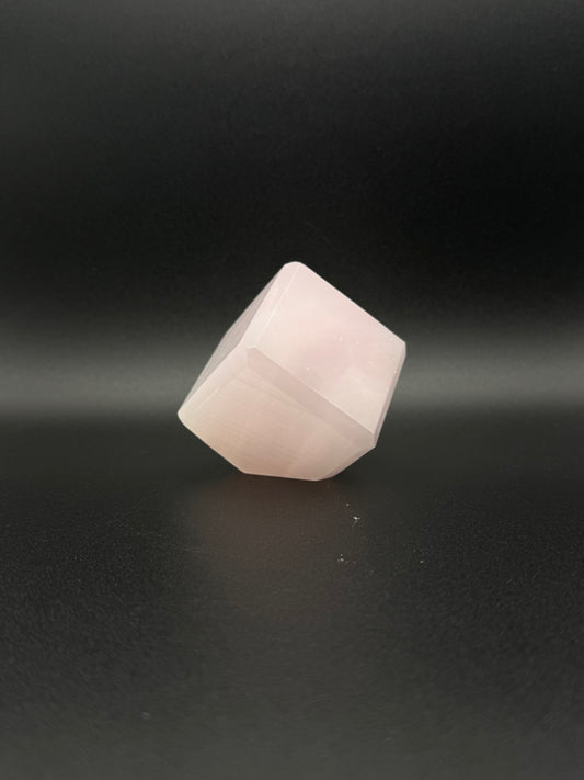 Polished Pink Calcite cut cube. Pink calcite is uv reactive.