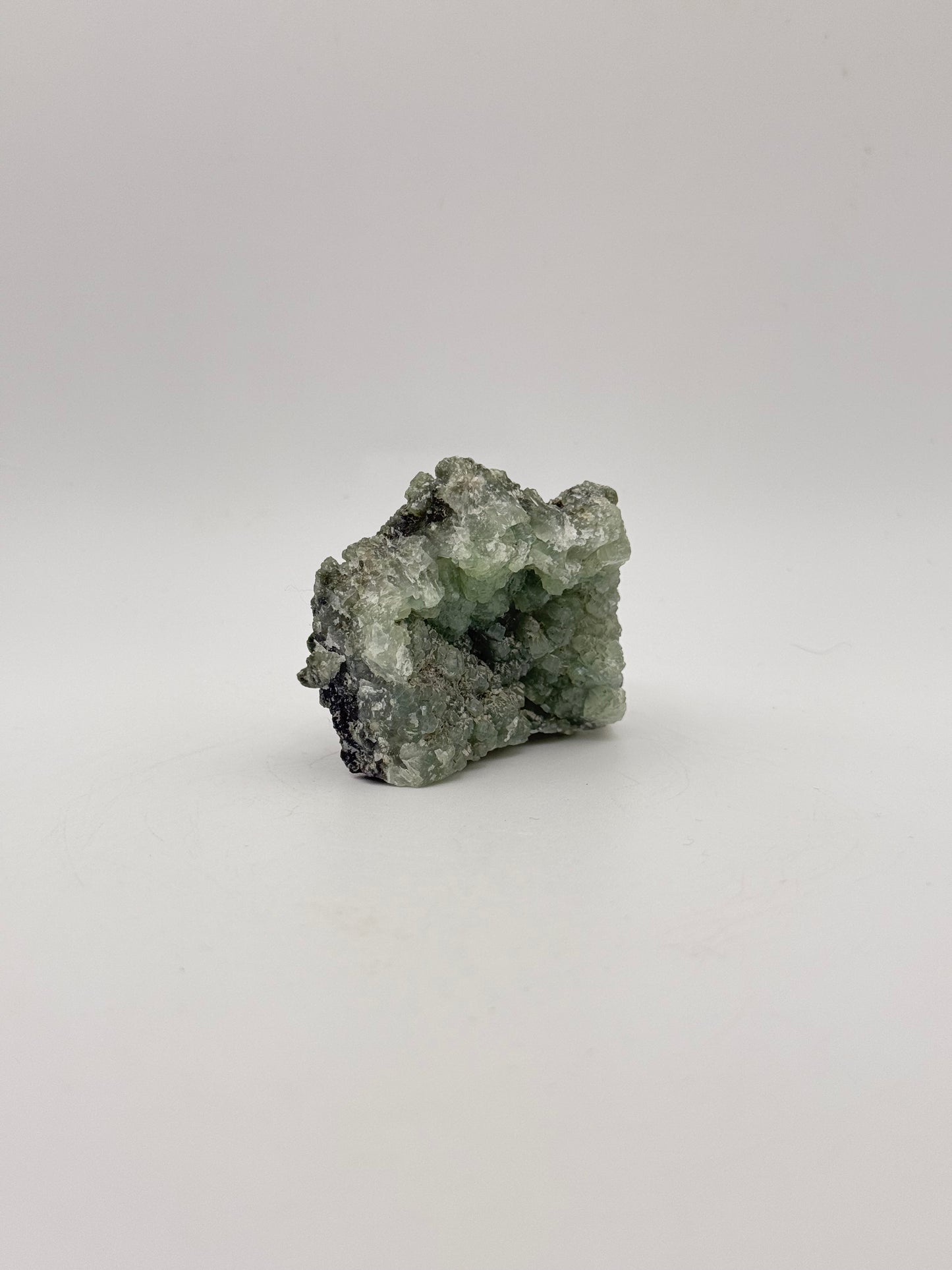 Raw Prehnite specimen with amazing green color.