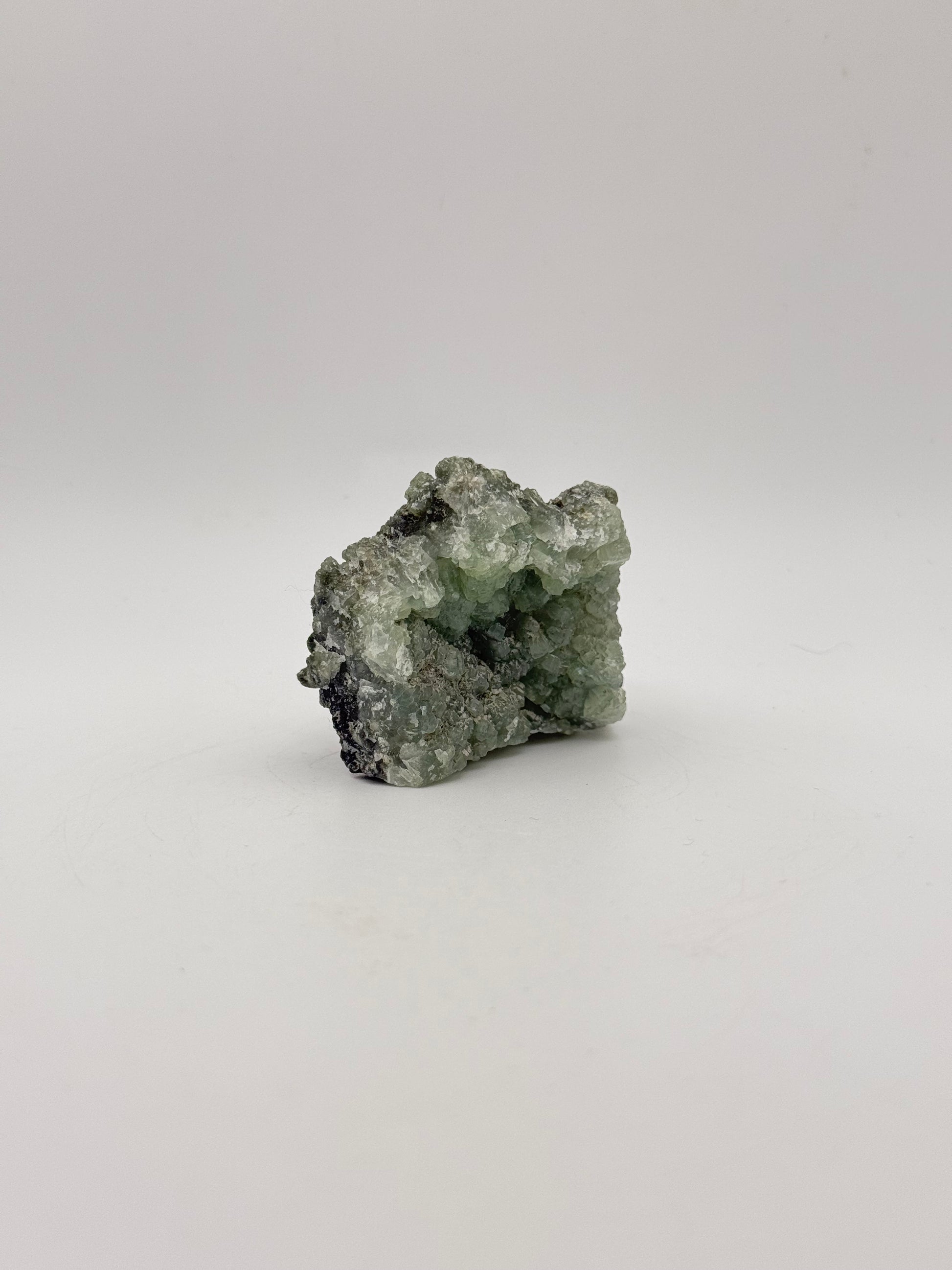 Raw Prehnite specimen with amazing green color.