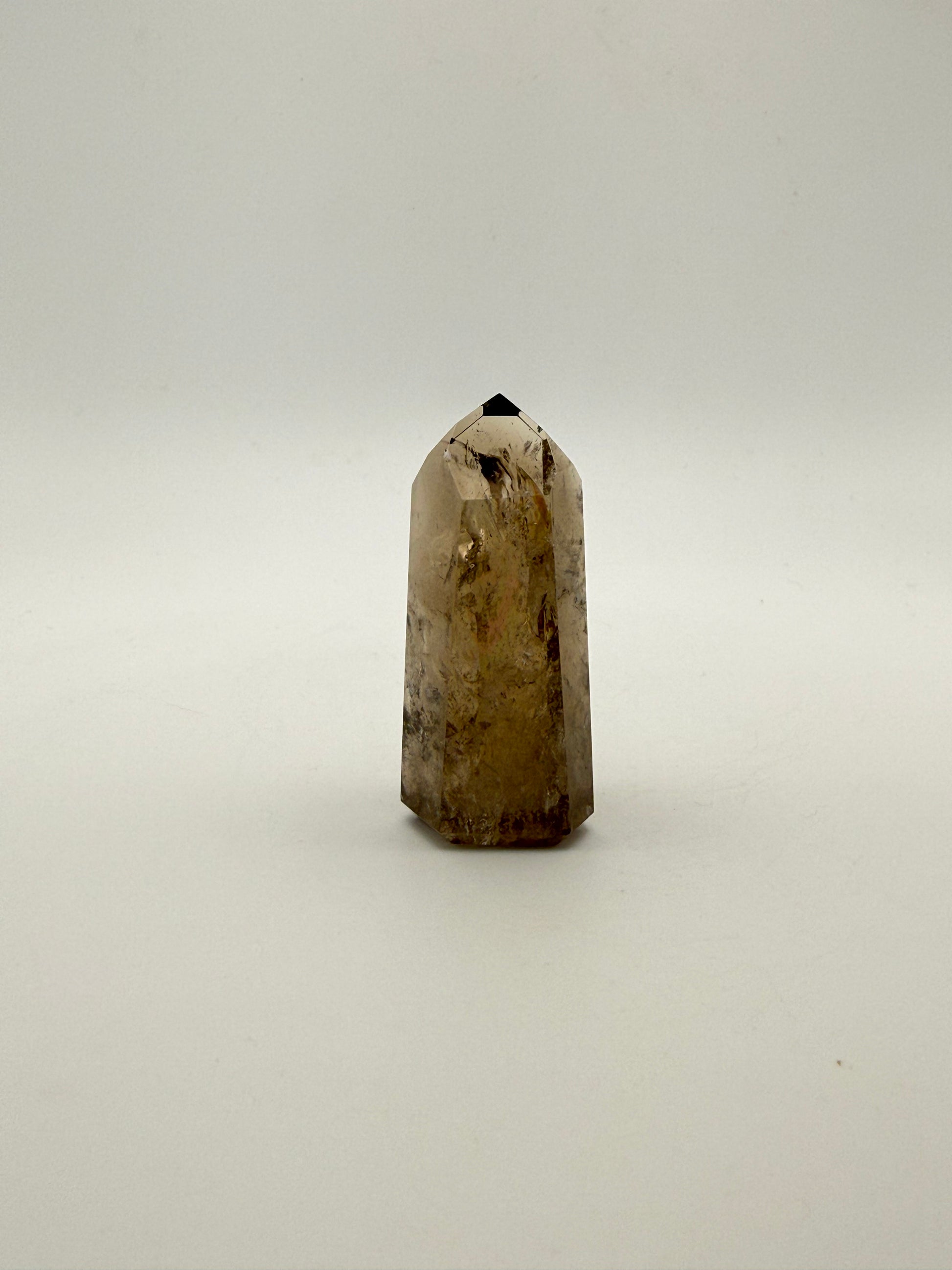 Polished natural citrine point.