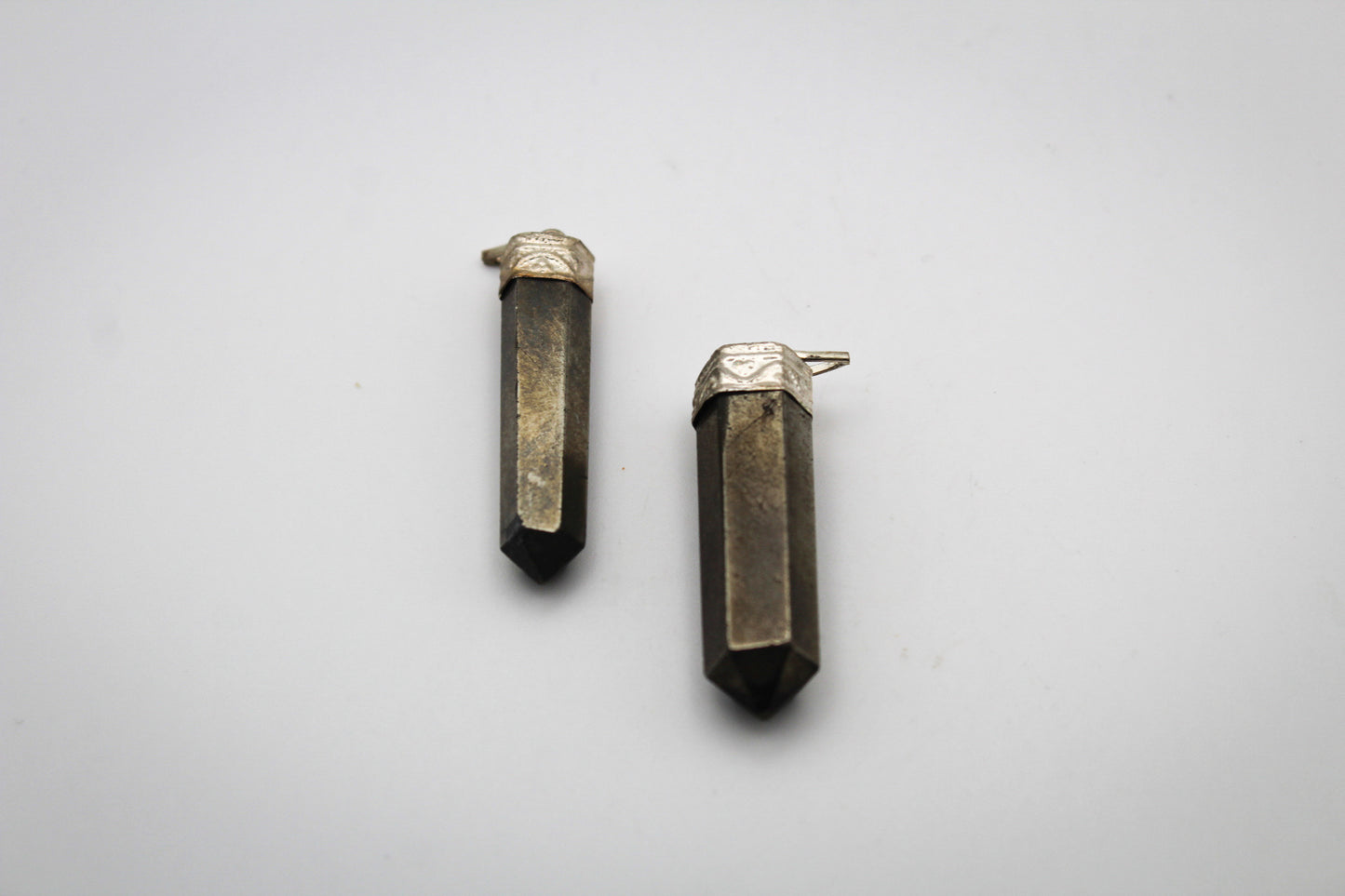 Pyrite pencil pendants.