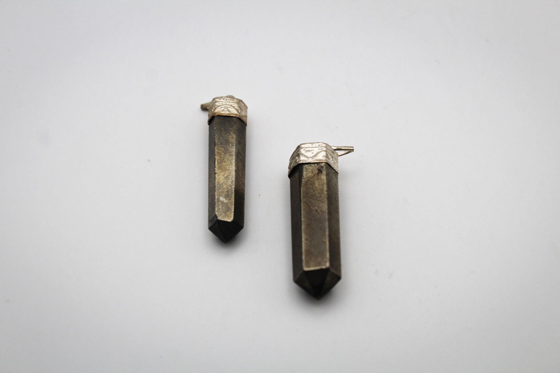 Pyrite pencil pendants.