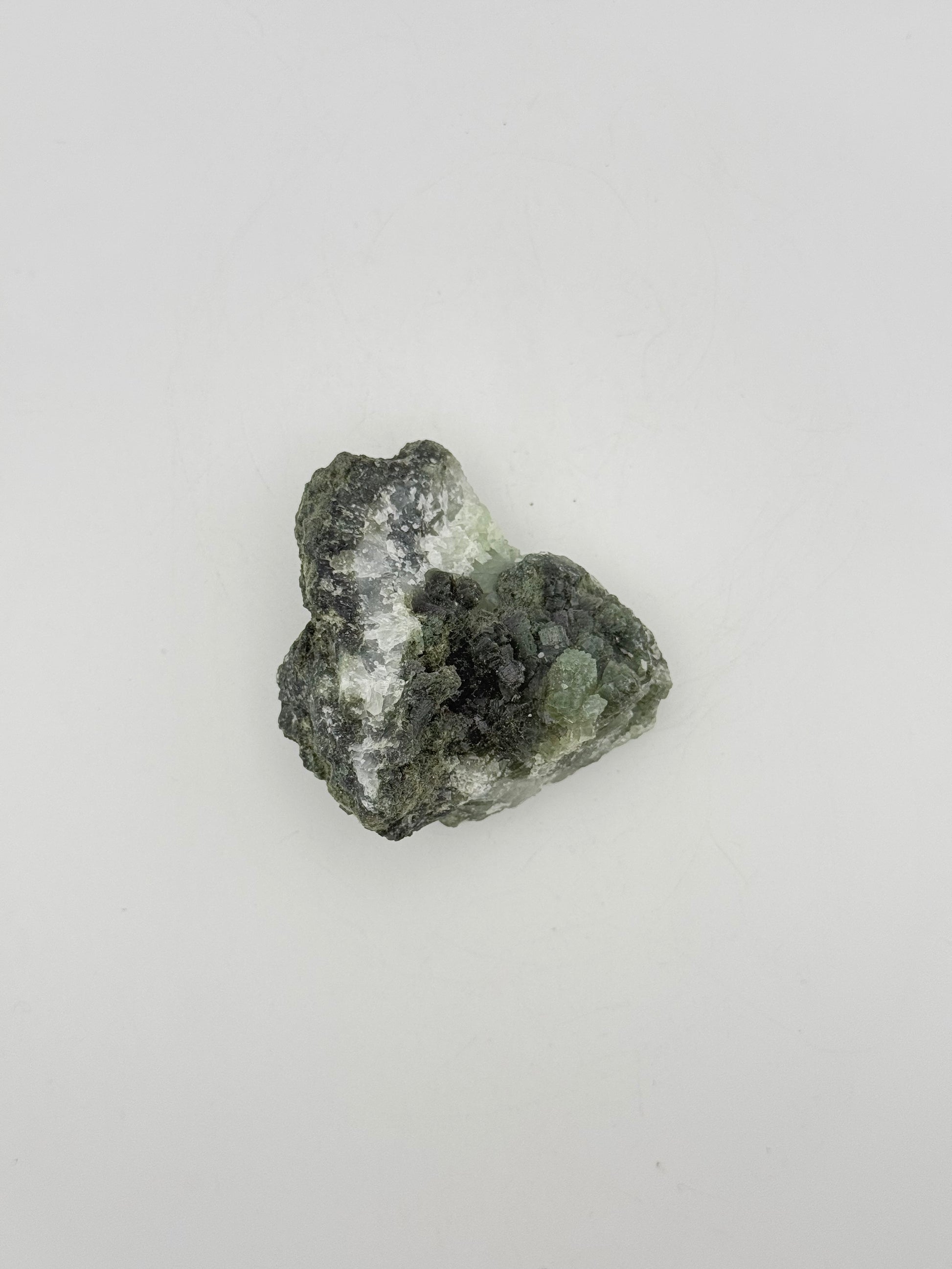 Raw Prehnite specimen with amazing green color.