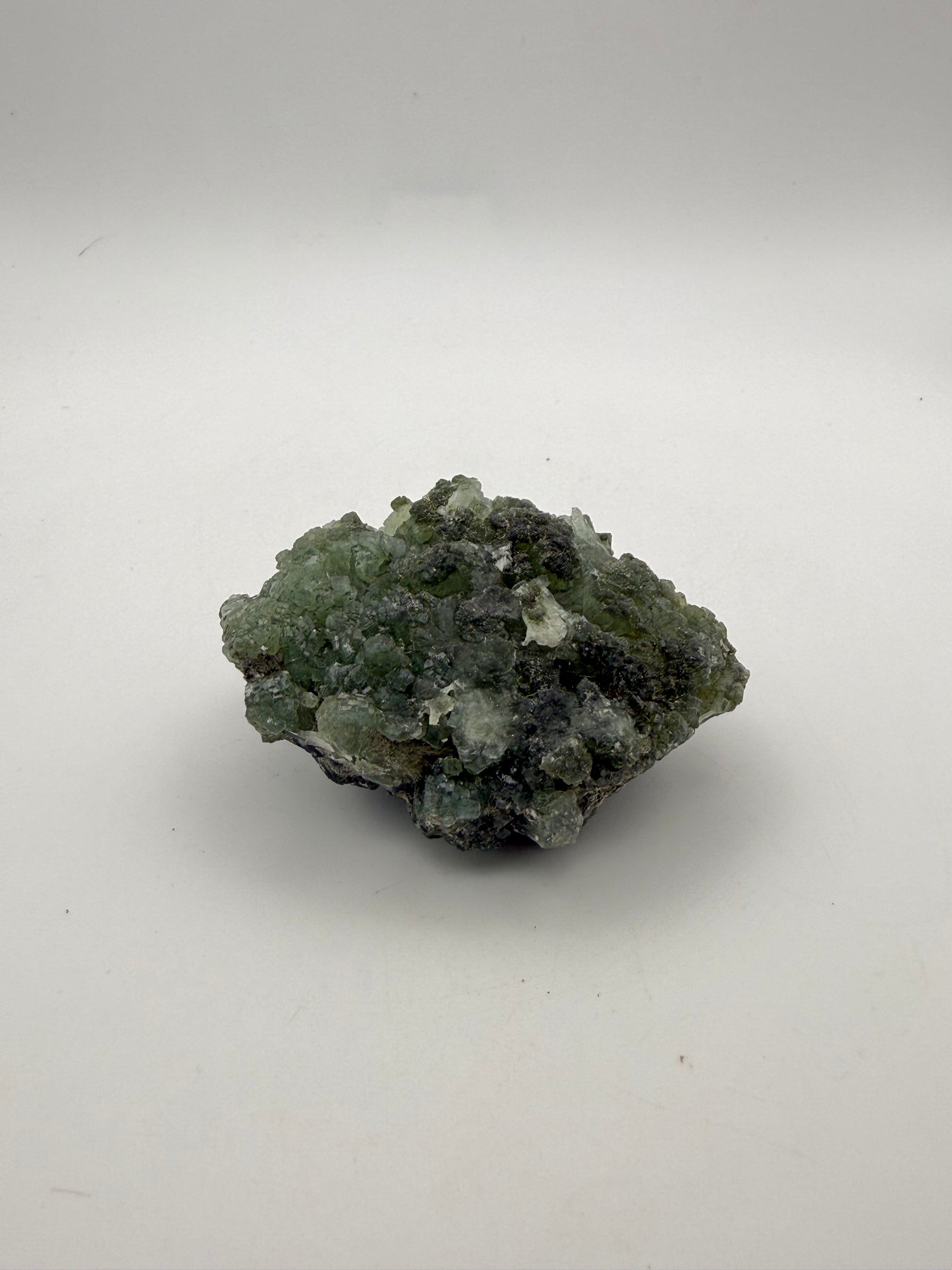 Raw Prehnite specimen with amazing green color.