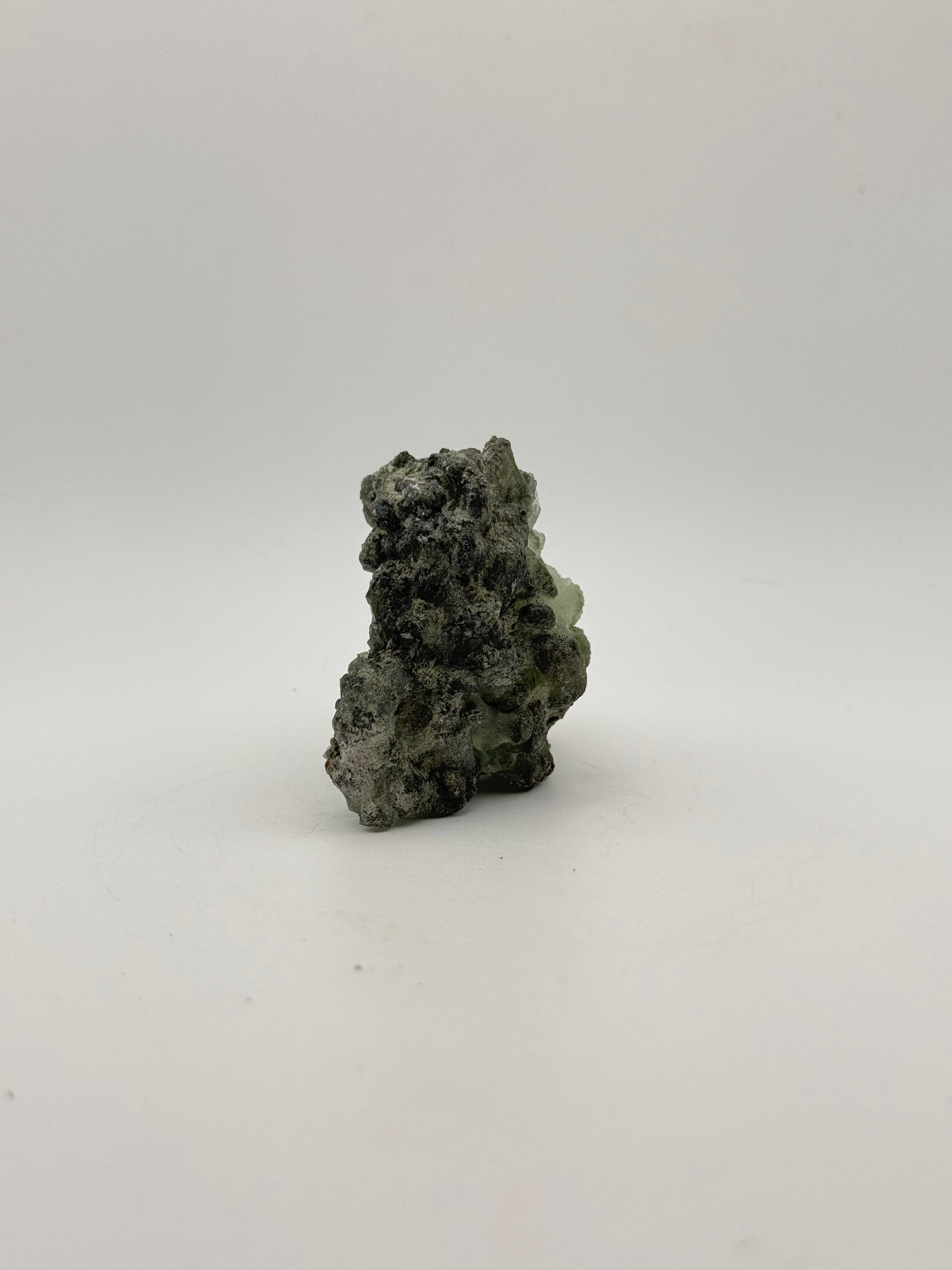 Raw Prehnite specimen with amazing green color.