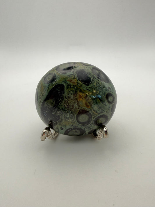 Polished kambaba jasper palm stone.