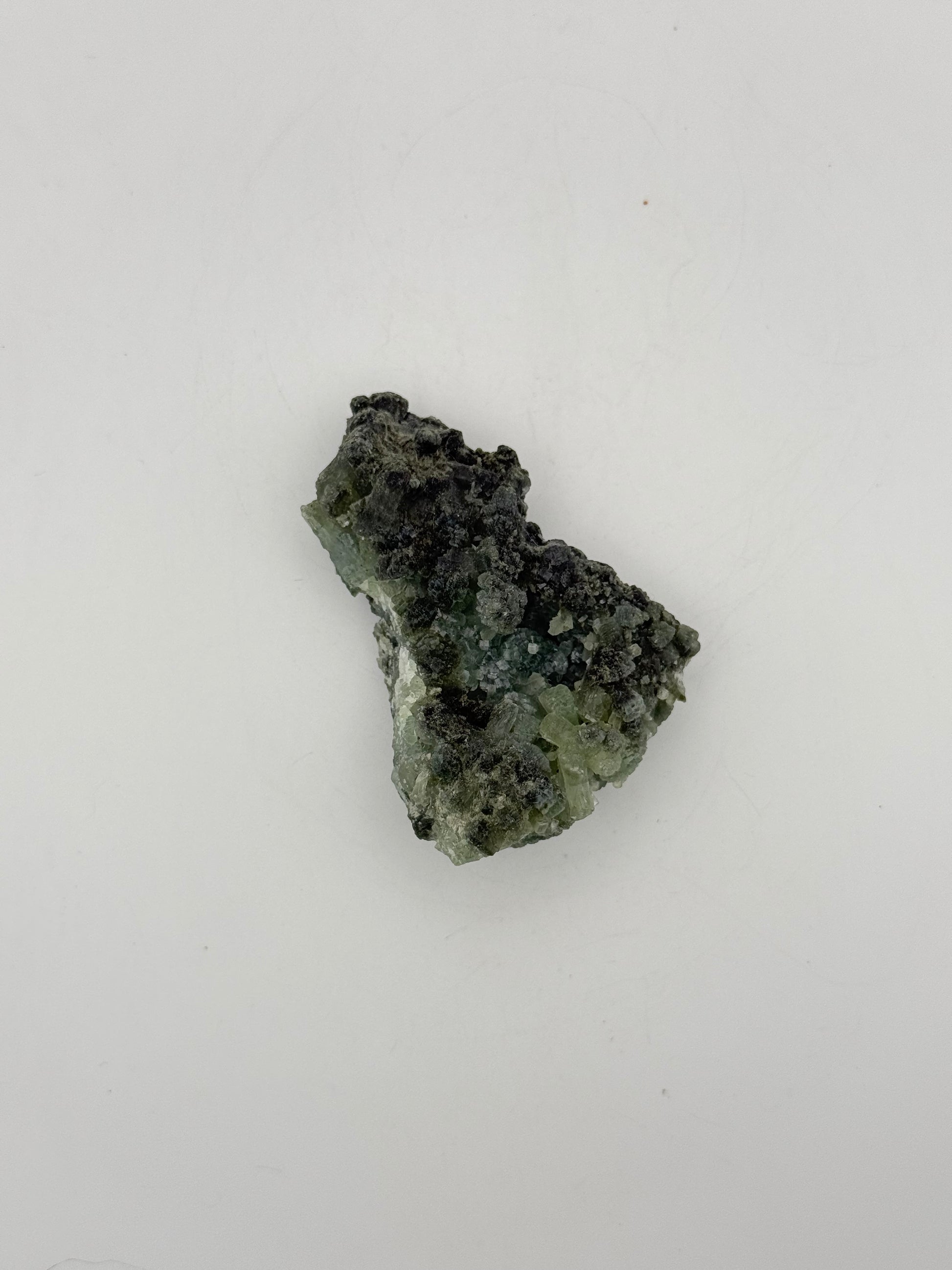 Raw Prehnite specimen with amazing green color.