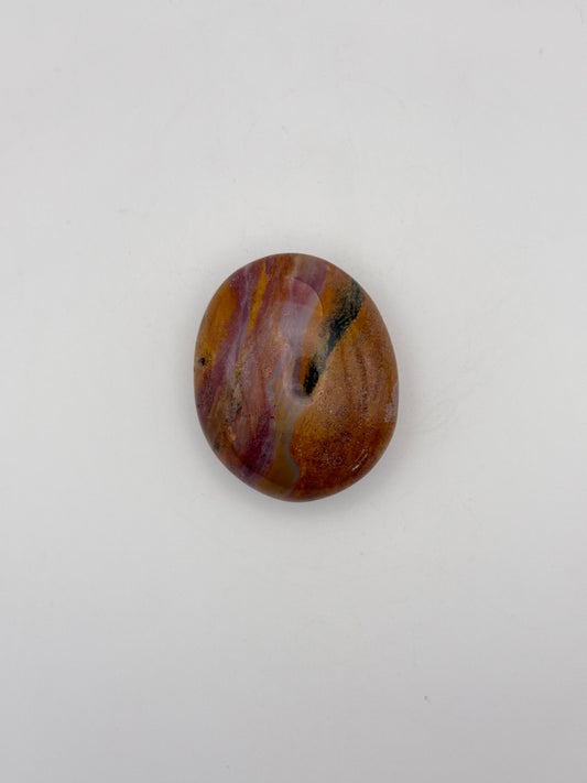 Polished ocean jasper palm stone.