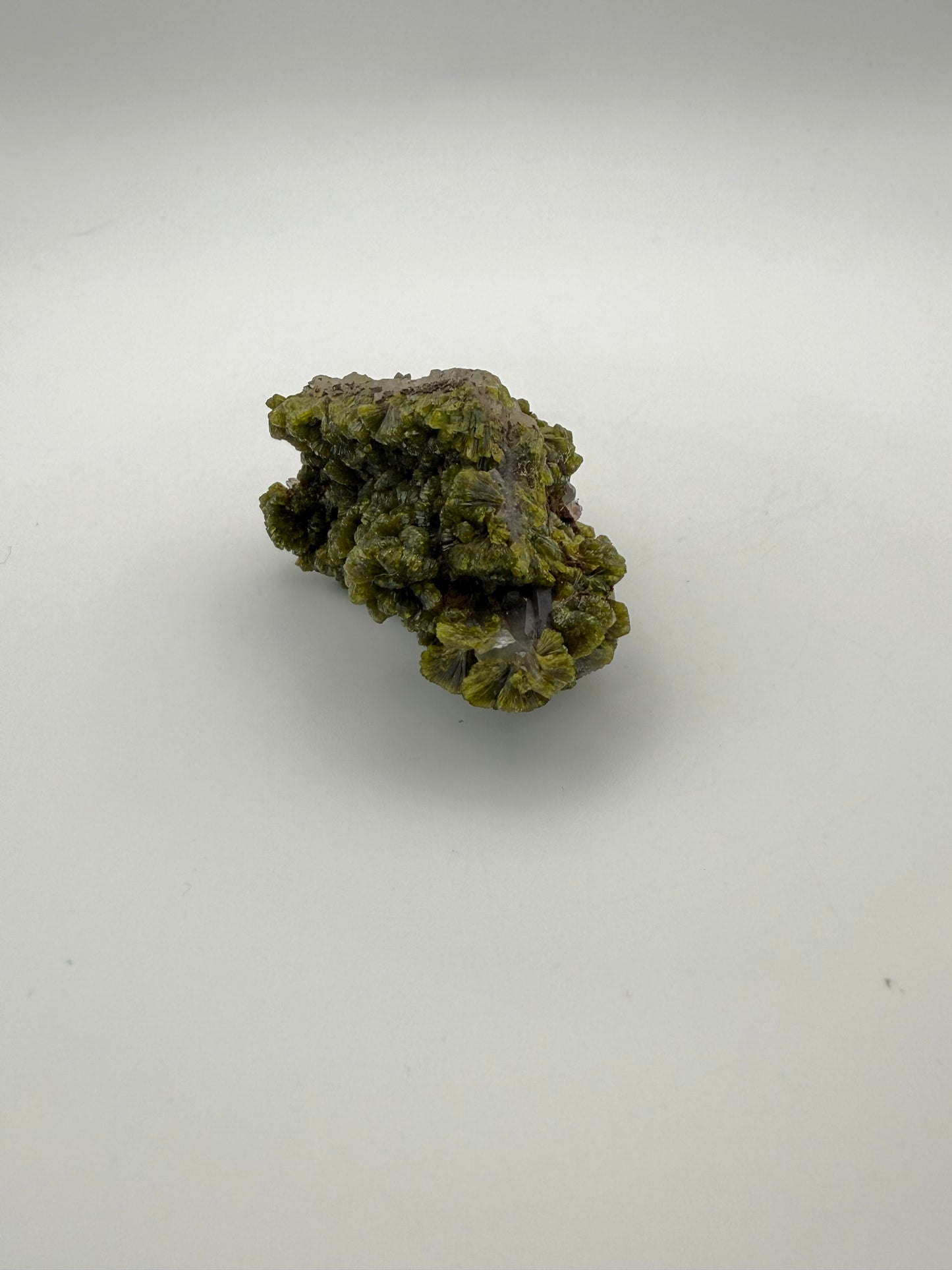 Epidote crystal cluster with good green color.