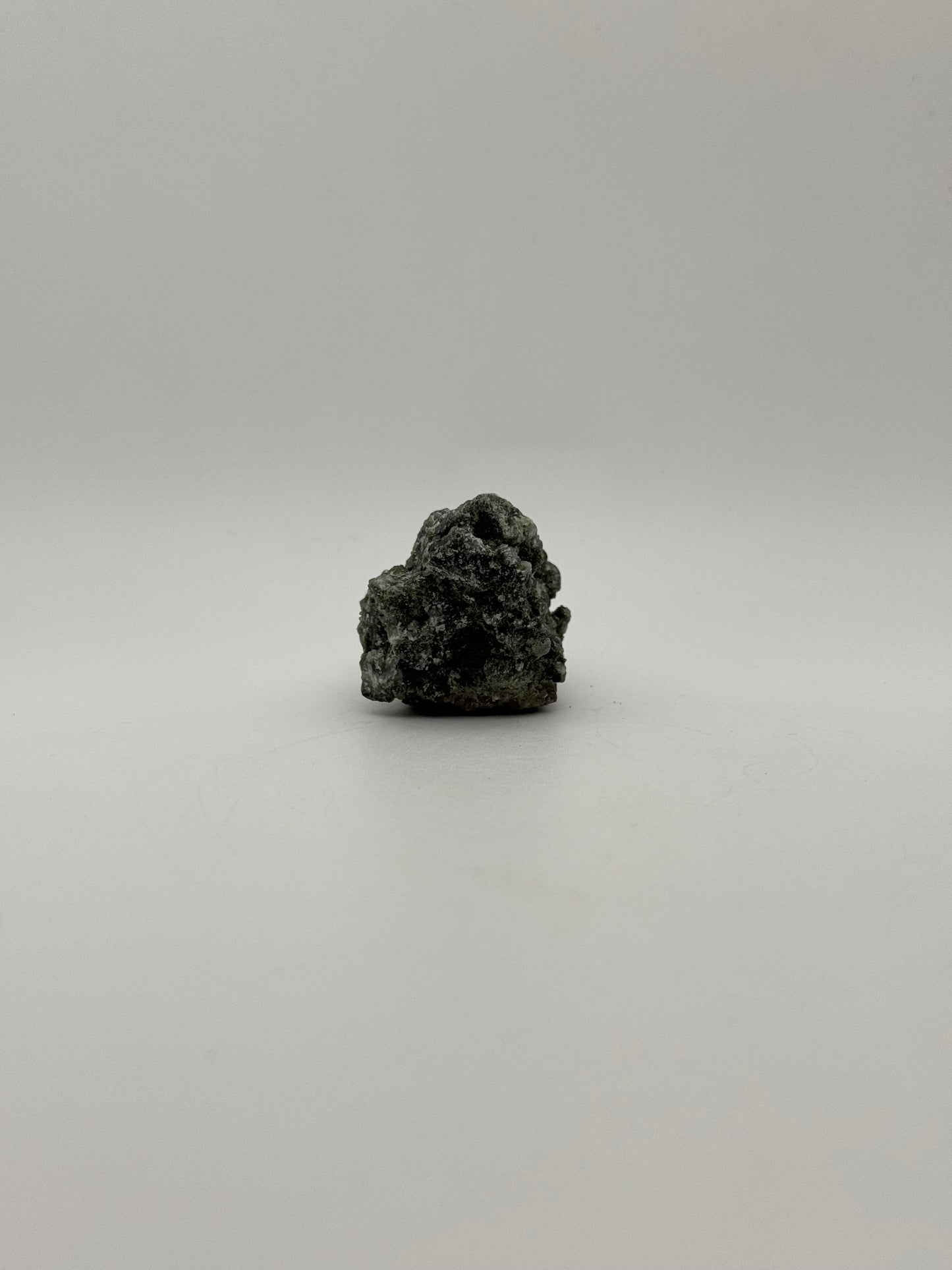 Raw prehnite specimen with amazing green color.