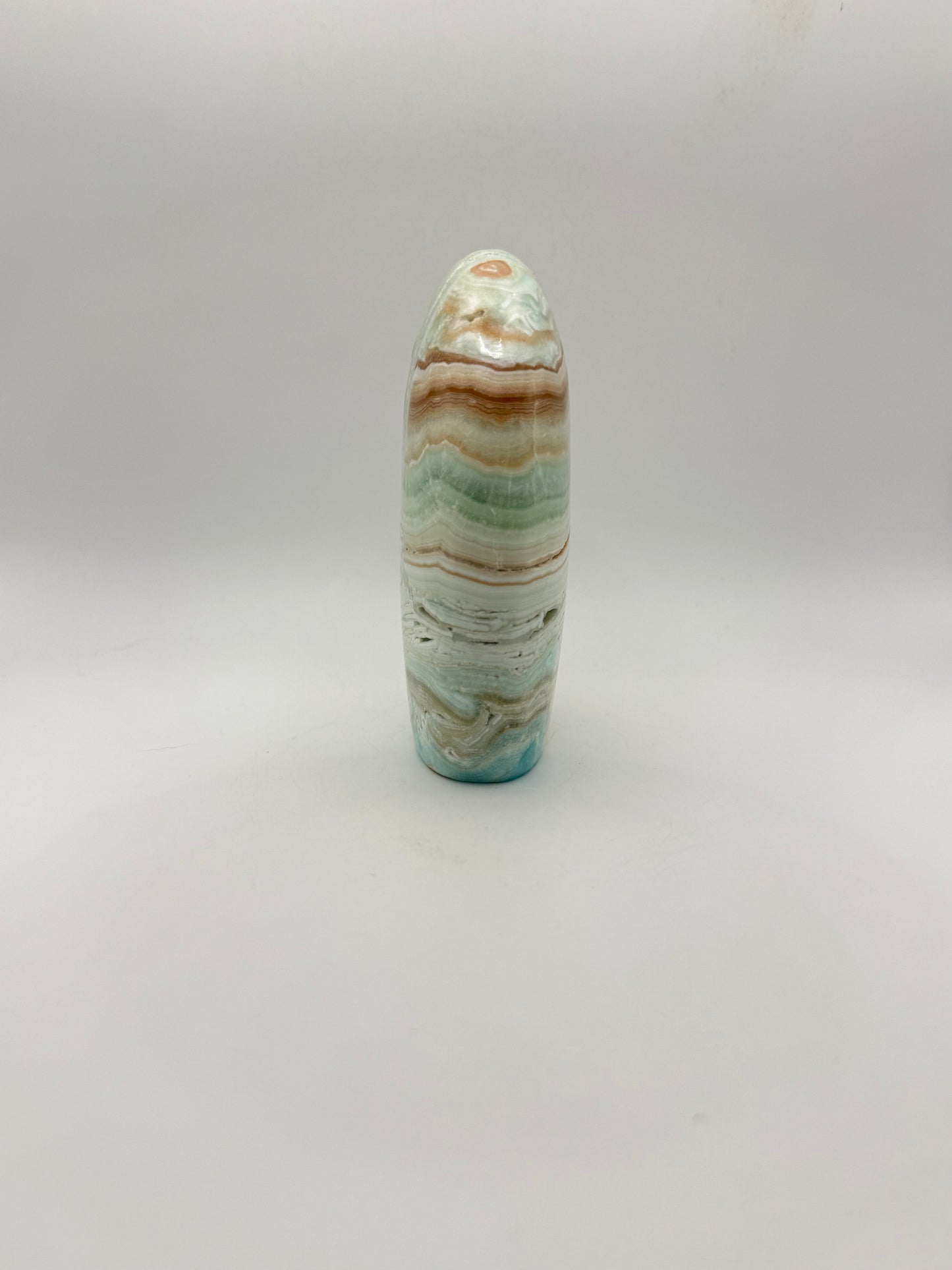 Caribbean calcite polished crystal free form in the shape of a dome.