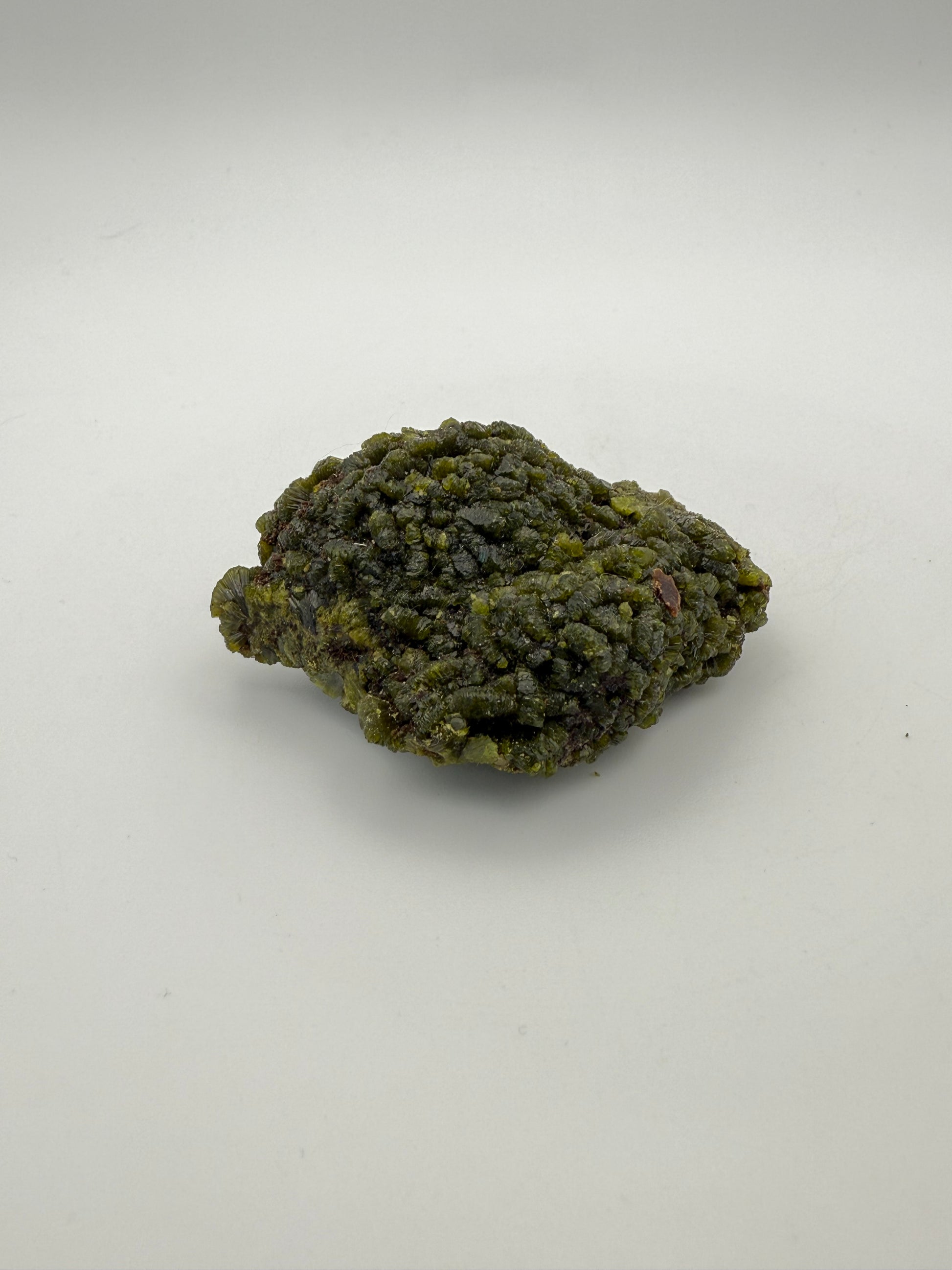 Epidote crystal cluster with good green color.