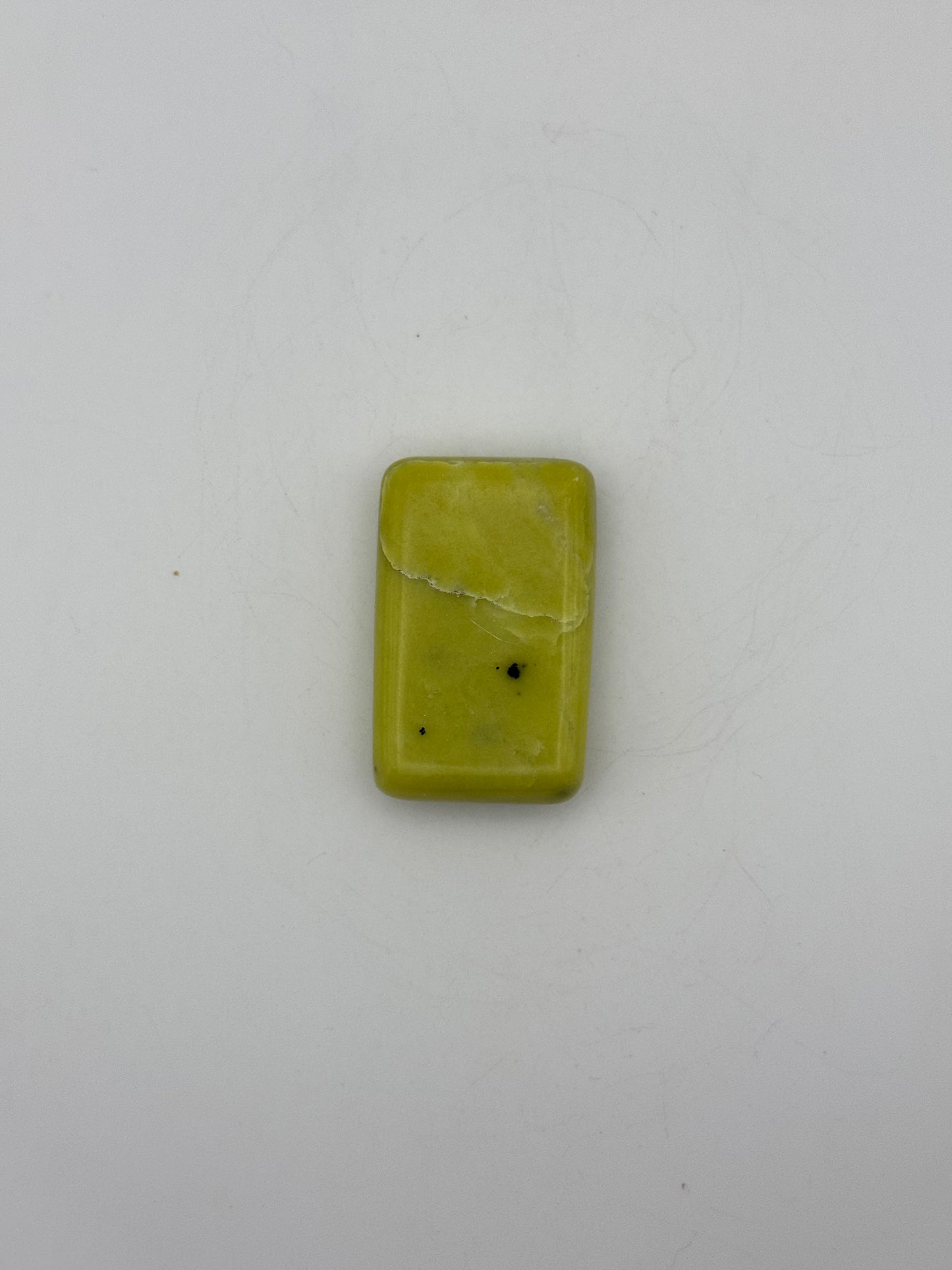 Polished healerite in the shape of a rectangular soap.