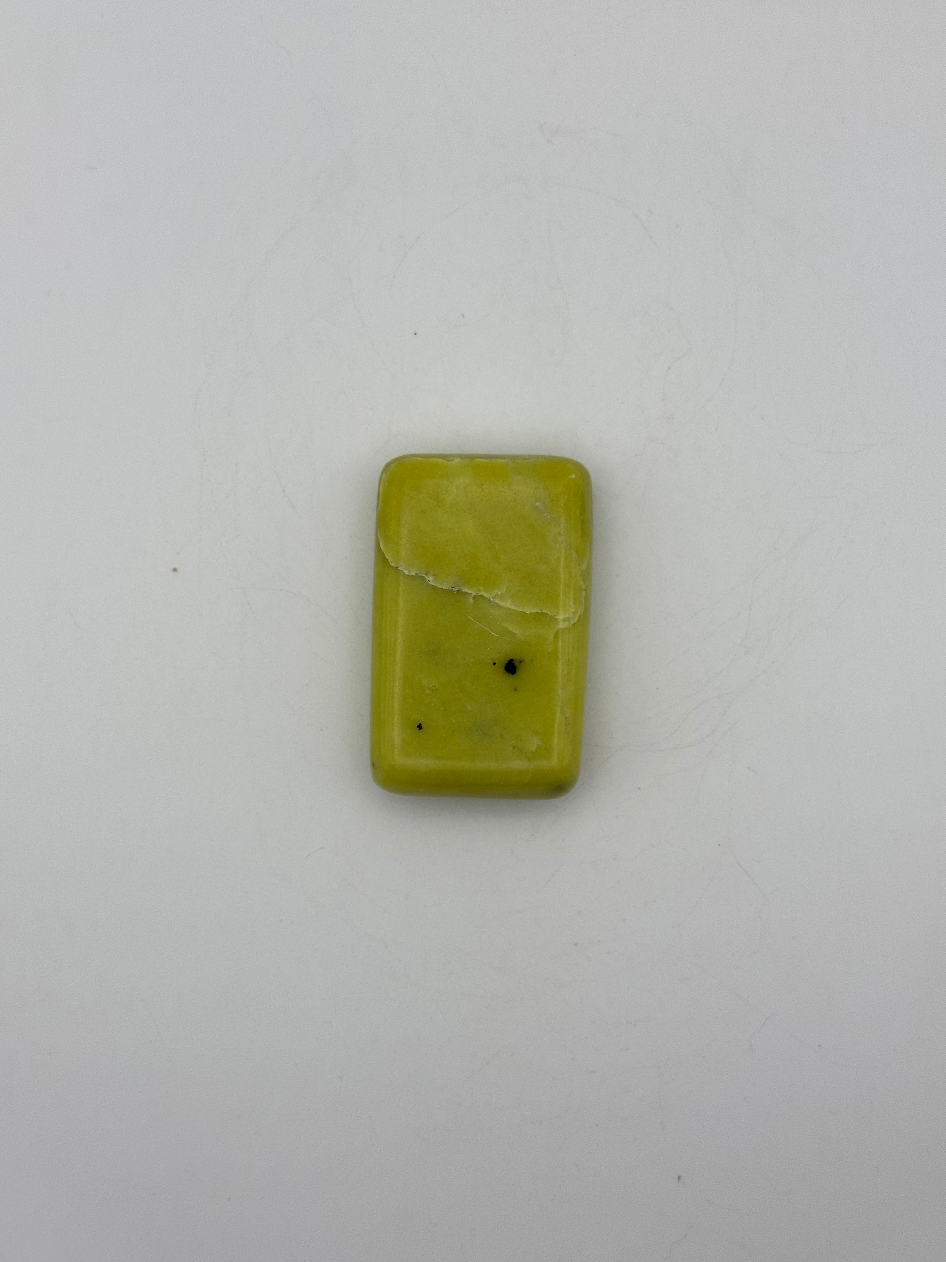 Polished healerite in the shape of a rectangular soap.