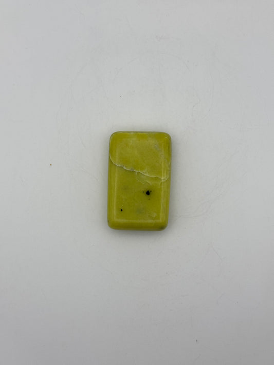 Polished healerite in the shape of a rectangular soap.