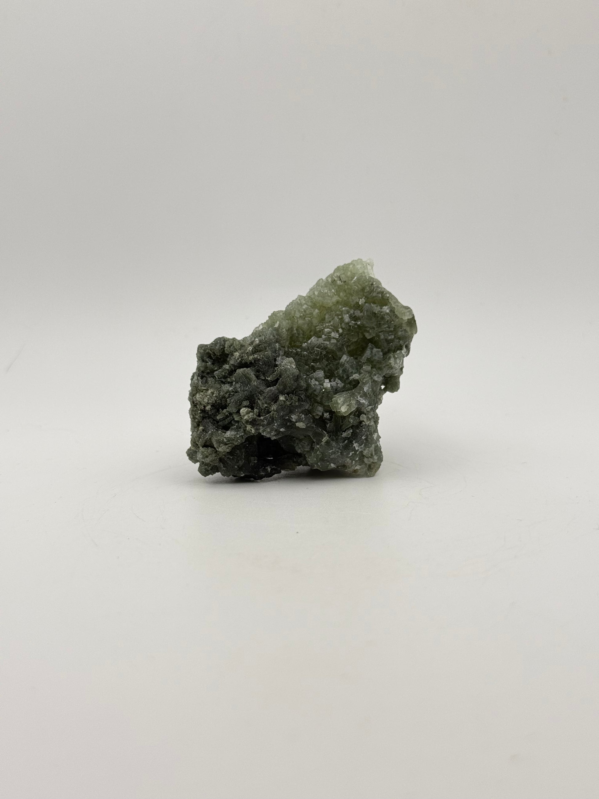 Raw prehnite specimen with good green coloring.