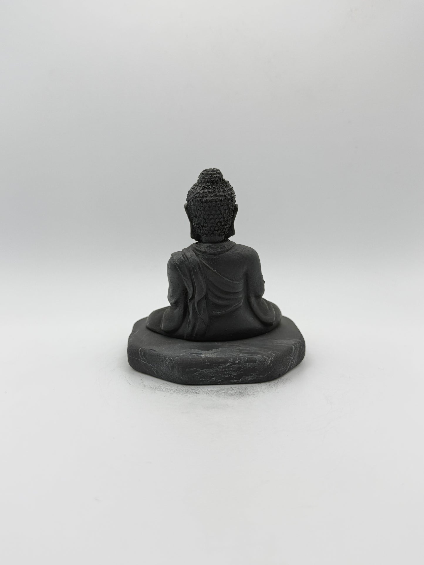 Shungite carving of a buddha.