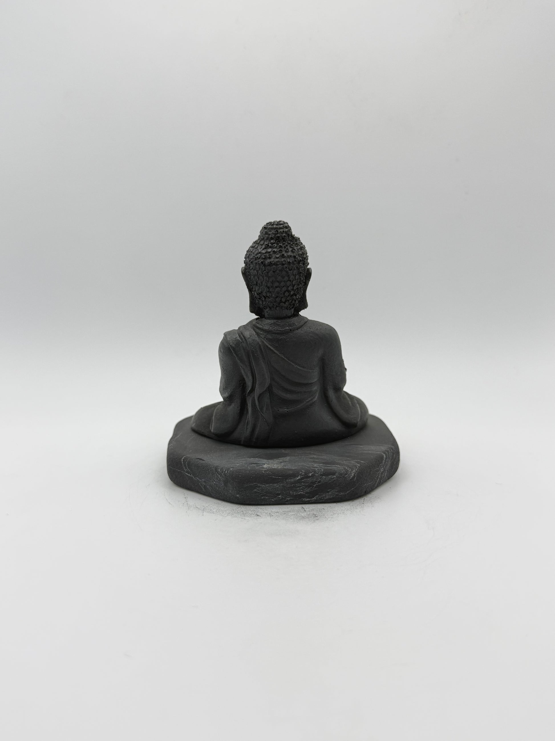 Shungite carving of a buddha.