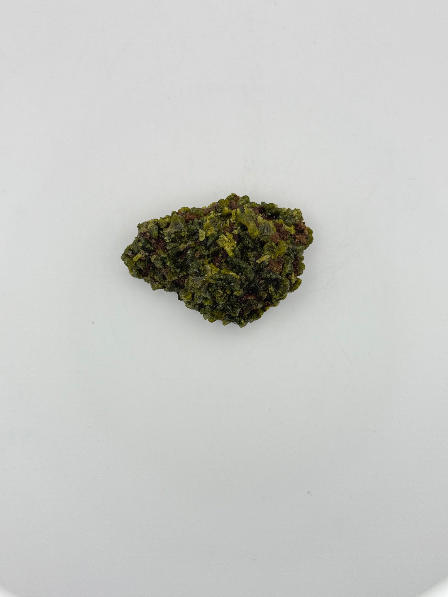 Epidote crystal cluster with good green color.