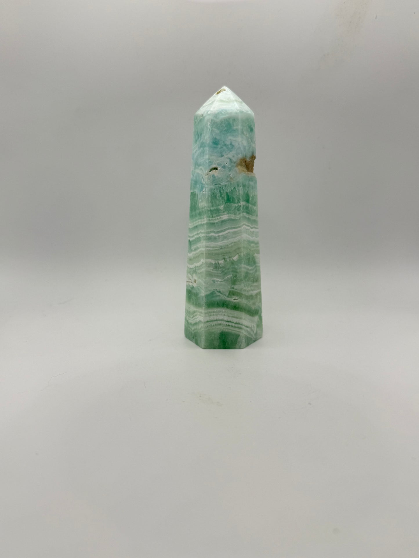 Caribbean Calcite polished six sided tower. This is 5.25 inches tall.