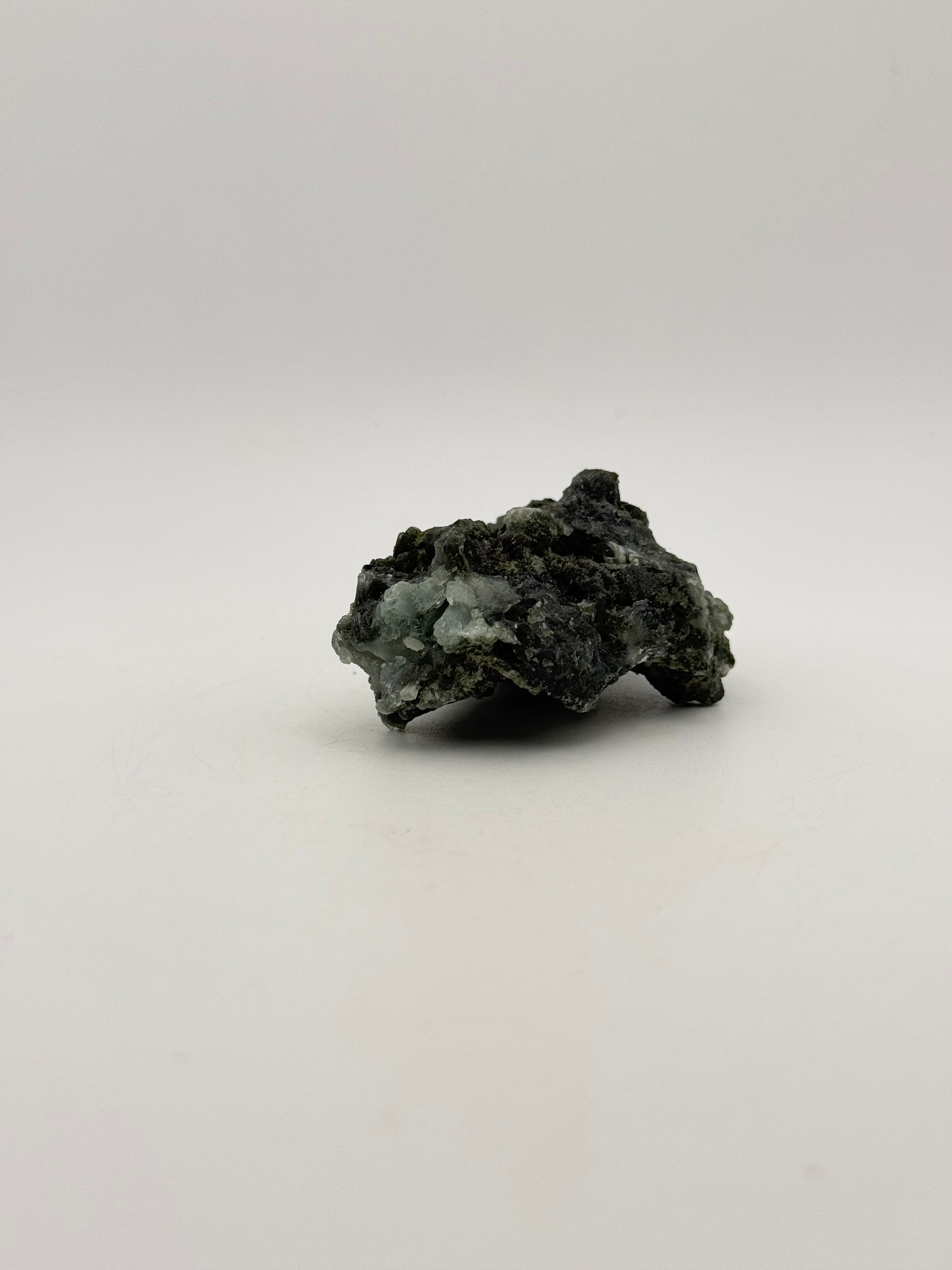 Raw Prehnite specimen with amazing green color.