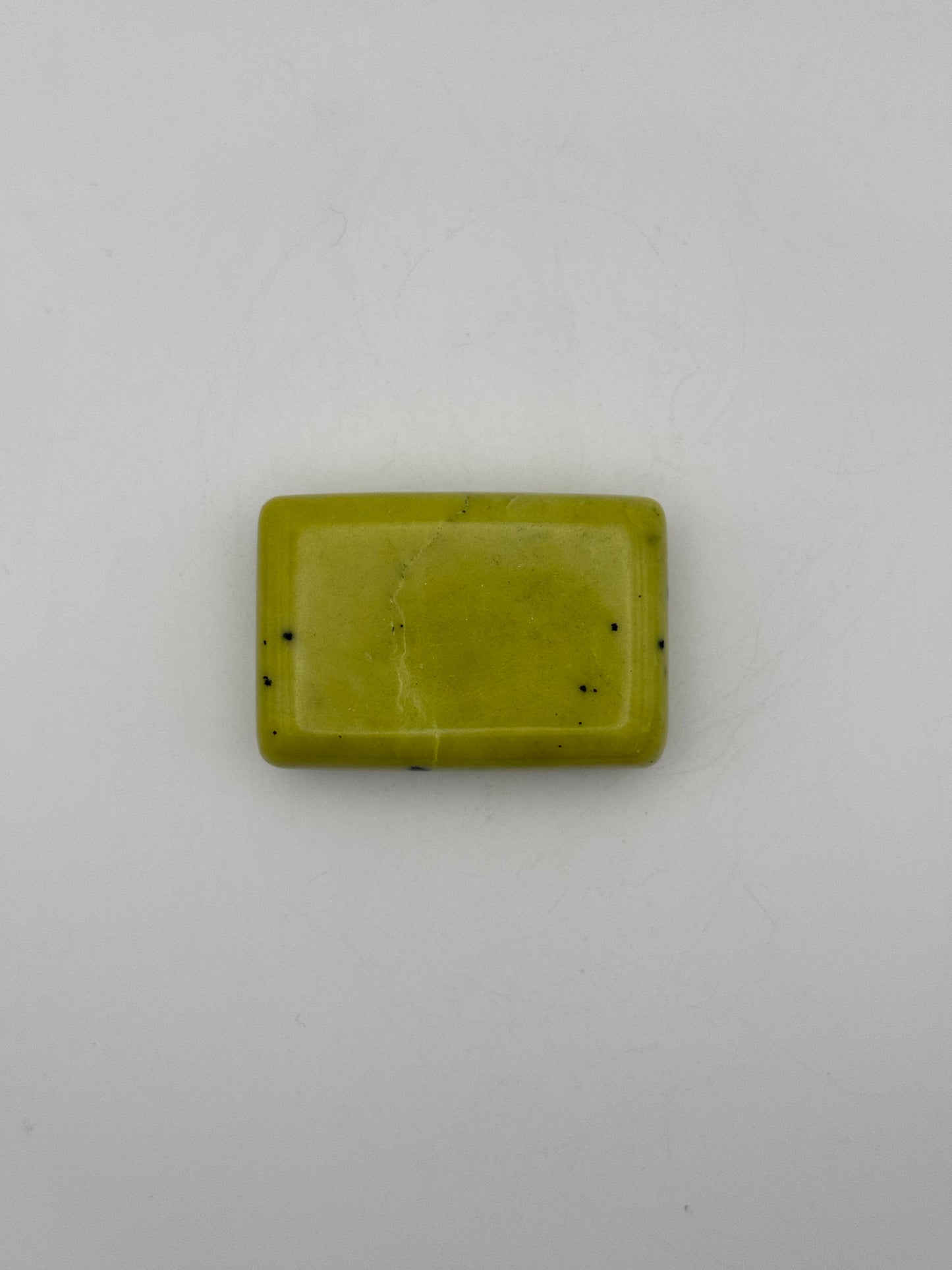 Polished healerite in the shape of a rectangular soap.
