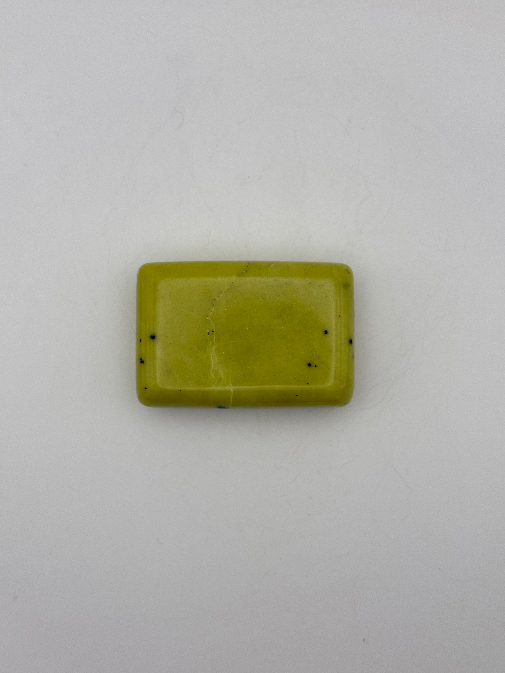 Polished healerite in the shape of a rectangular soap.