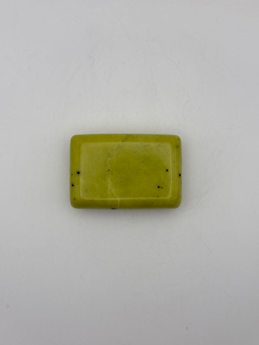 Polished healerite in the shape of a rectangular soap.