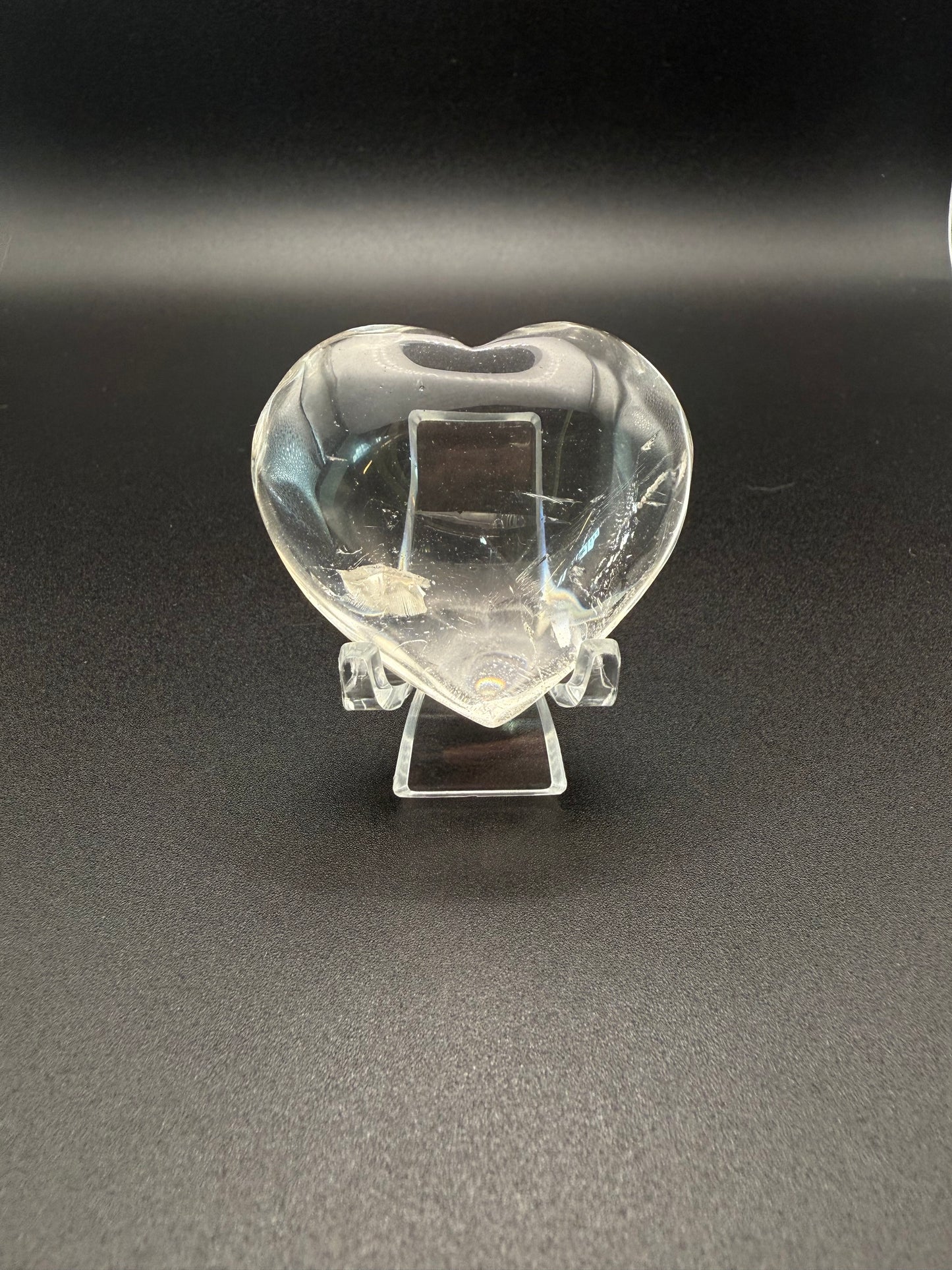 Clear quartz polished crystal heart.