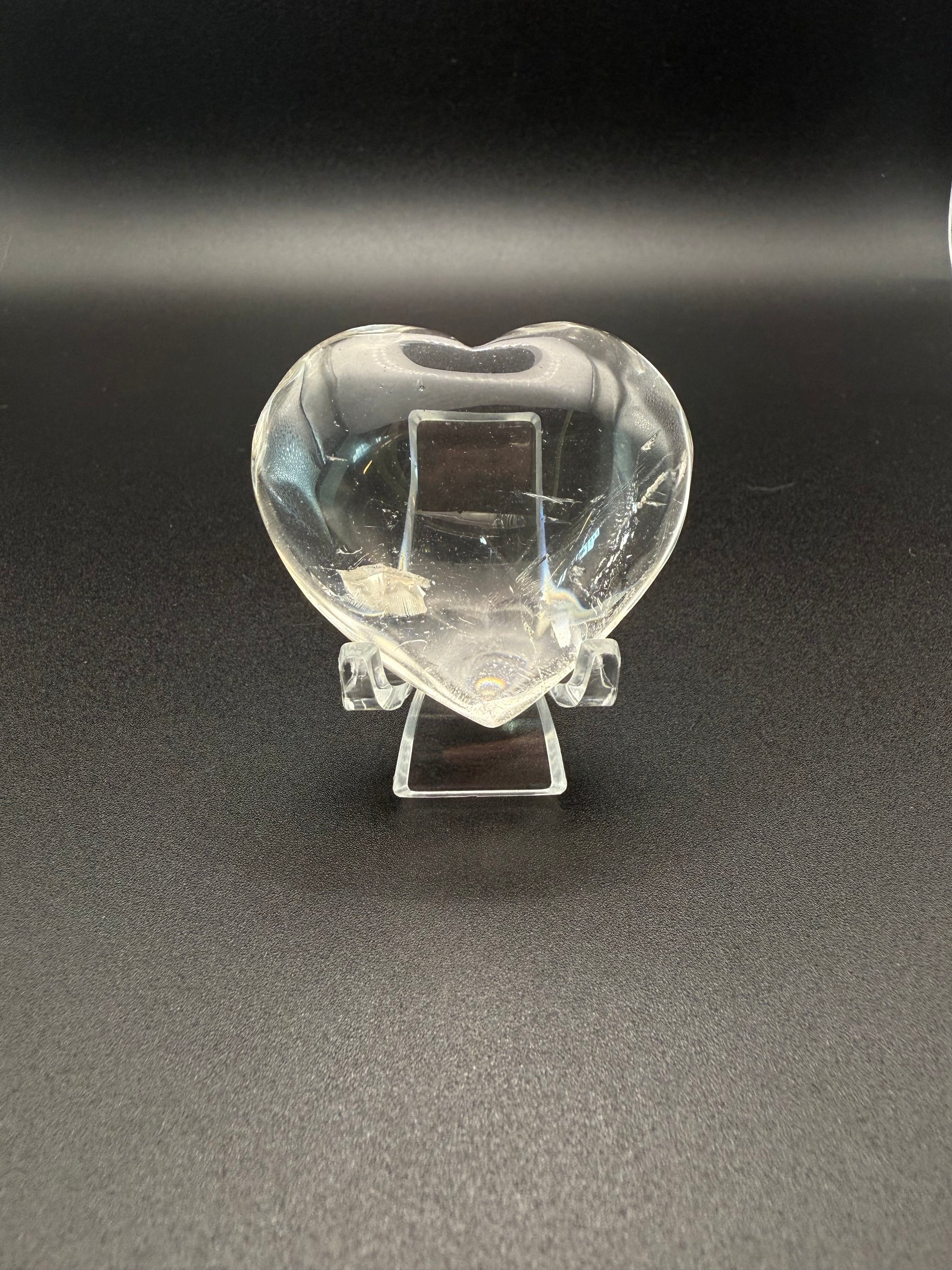 Clear quartz polished crystal heart.